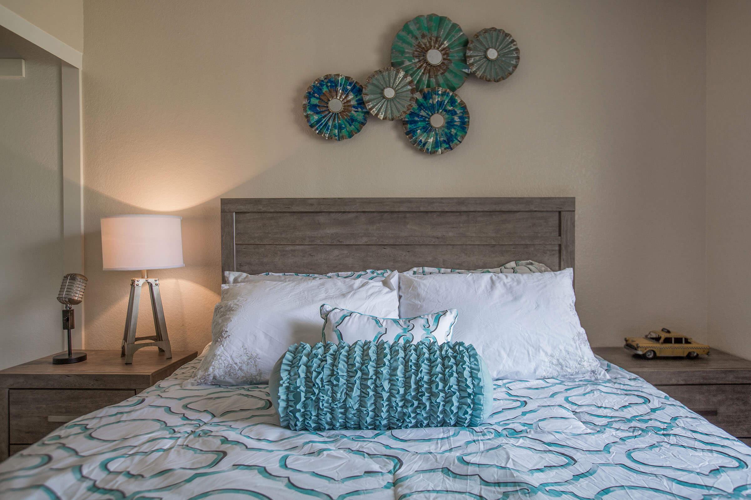 a bedroom with a bed in a room