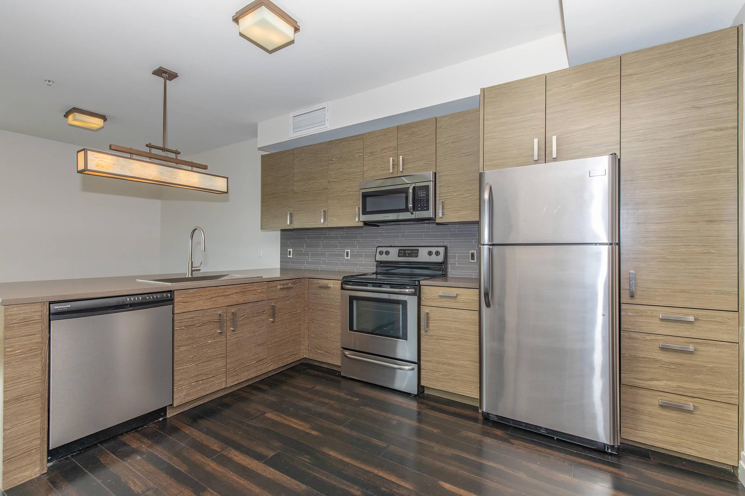 a modern kitchen with stainless steel appliances