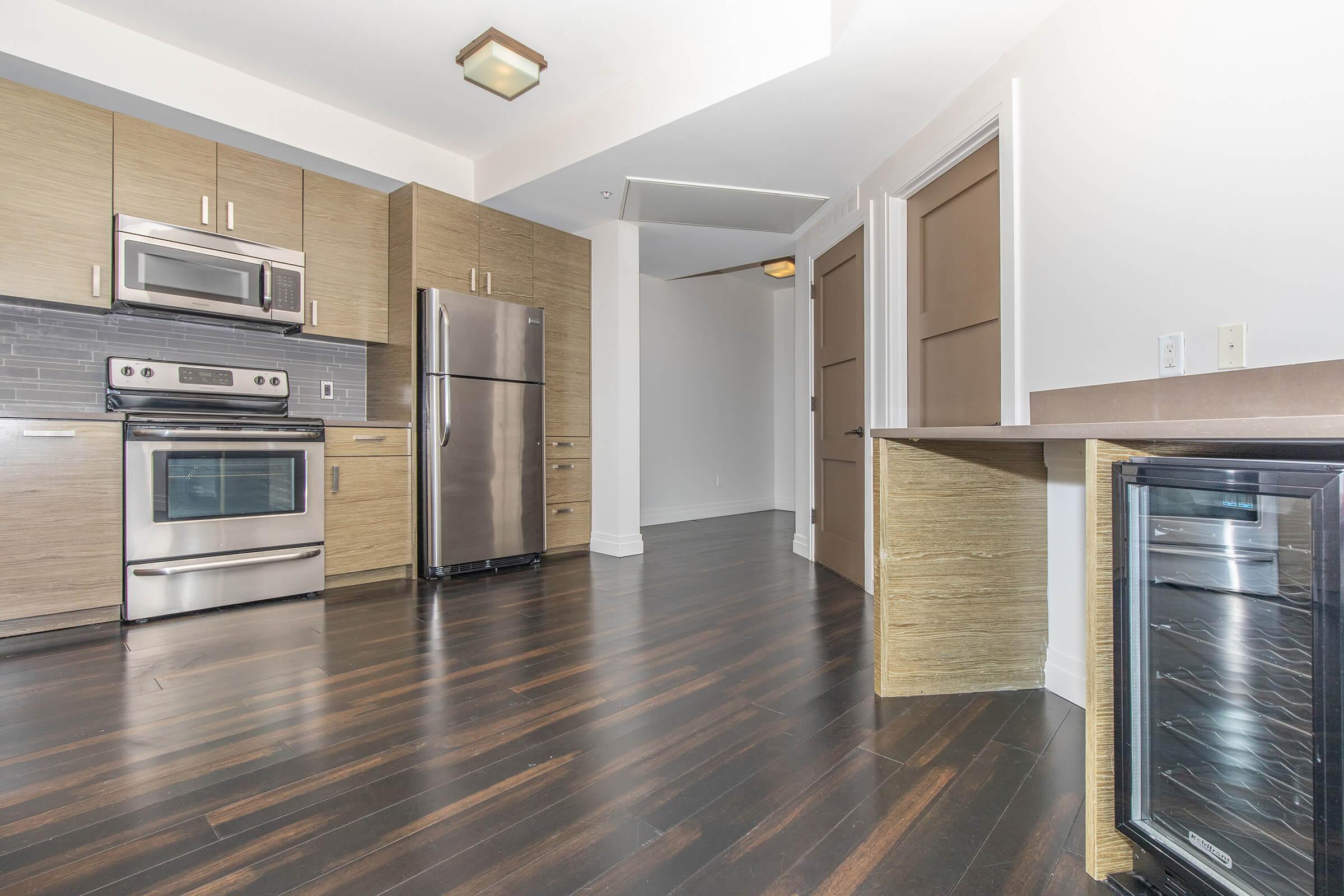 a large kitchen with stainless steel appliances