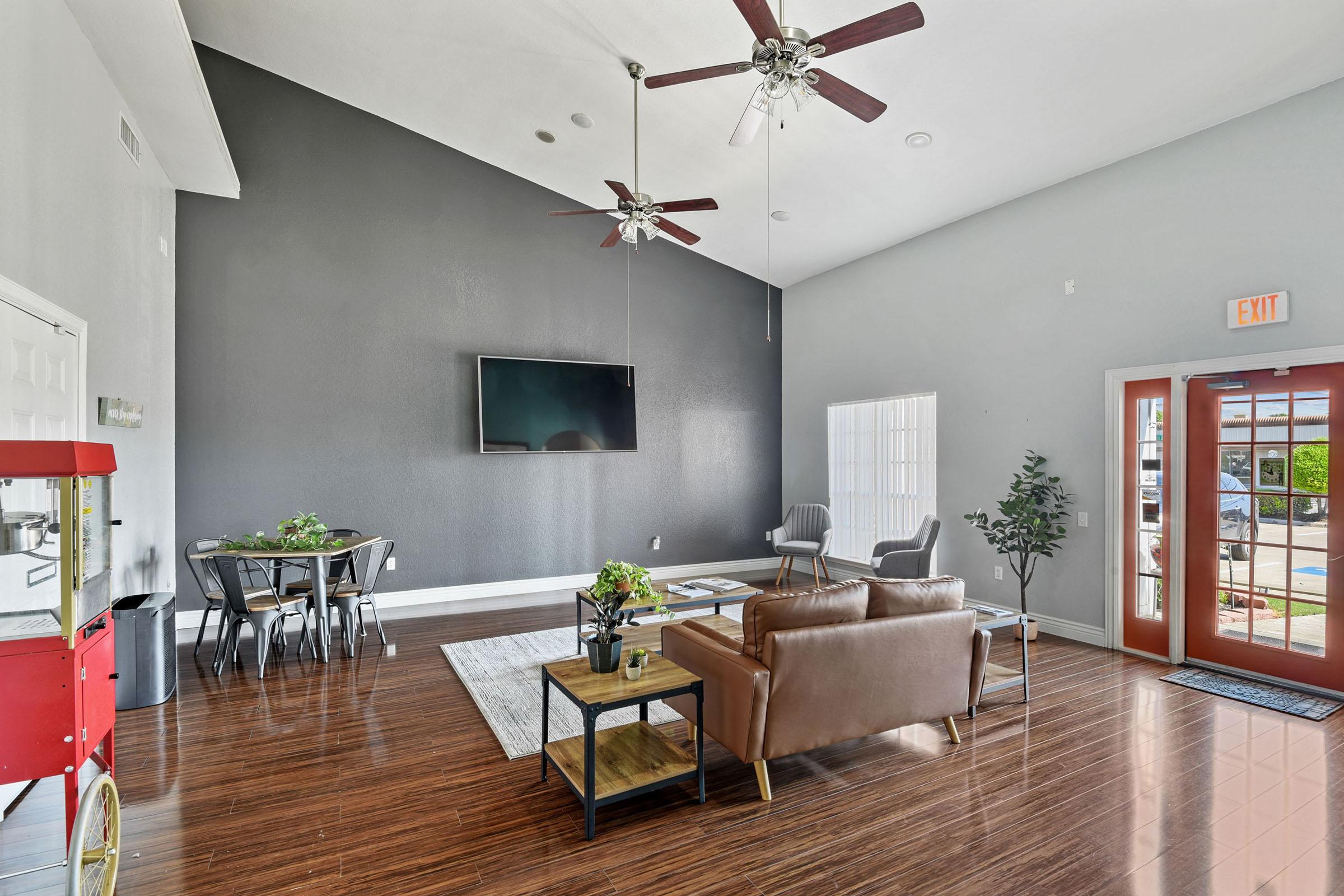 a living room filled with furniture and a large window