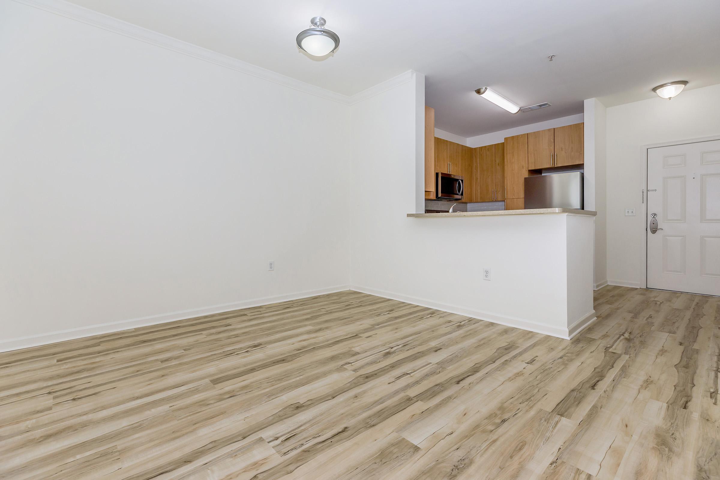 a bedroom with a wooden floor