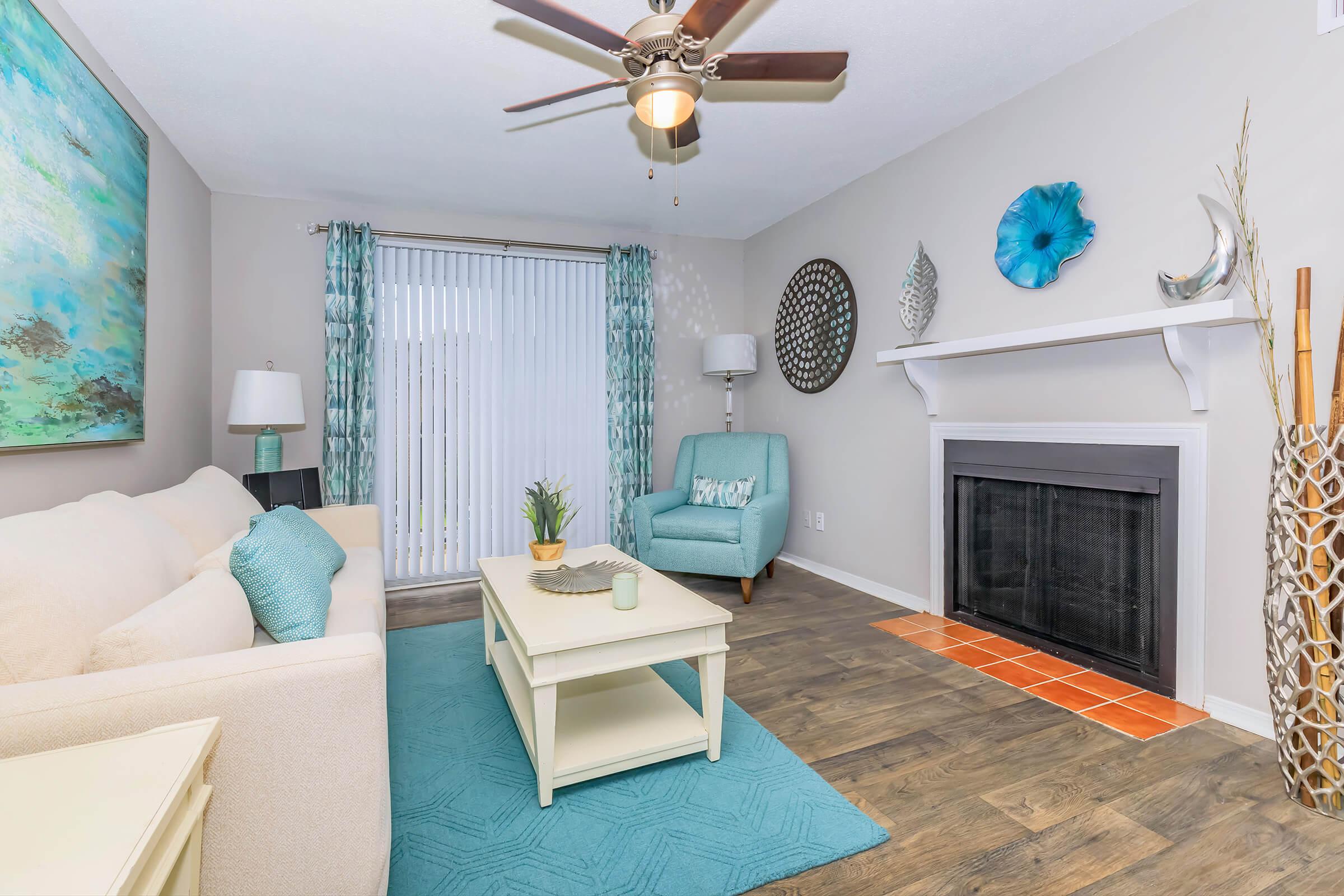 a living room filled with furniture and a fire place