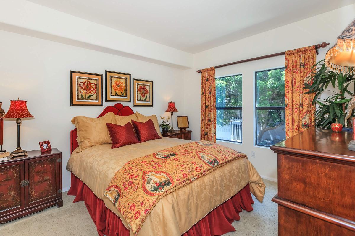 a bedroom with a large bed in a room