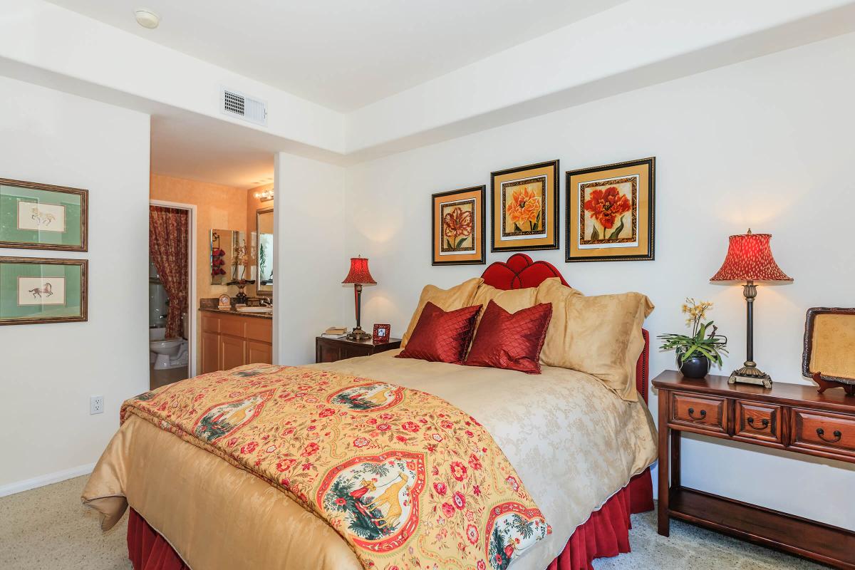 a bedroom with a large bed in a room