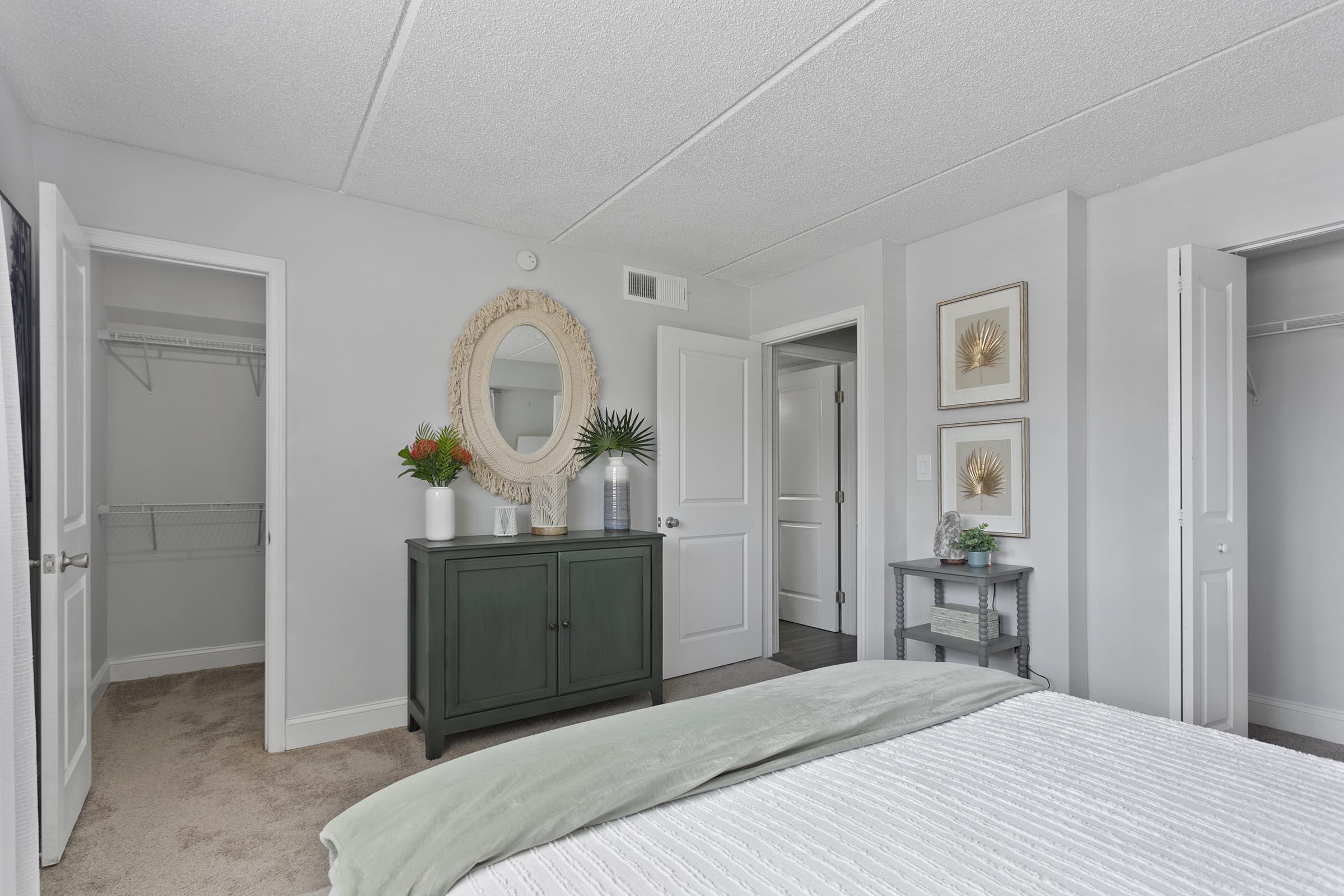 a bedroom with a large bed in a room