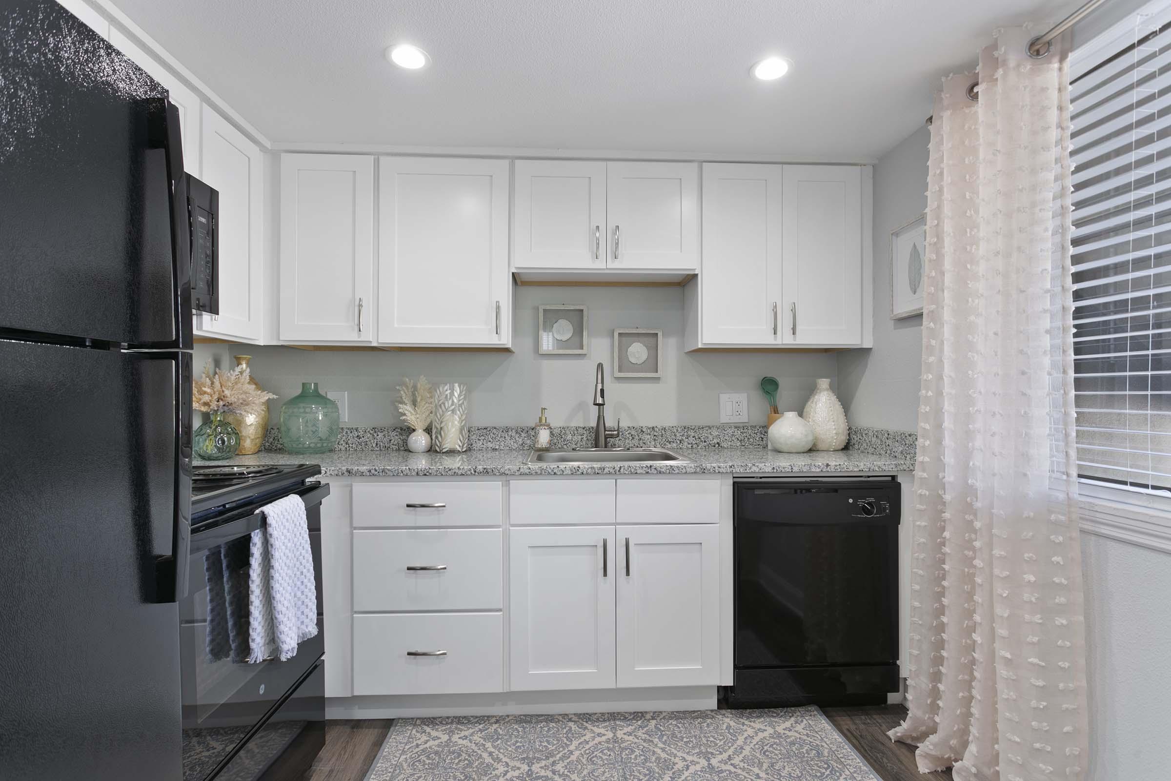 a stainless steel refrigerator in a kitchen