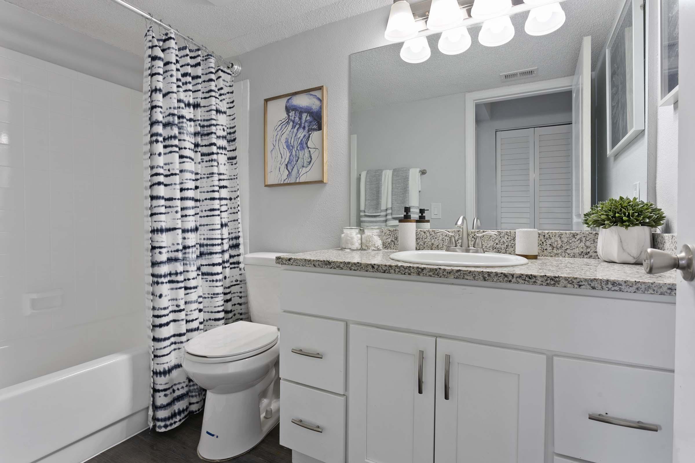 a kitchen with a sink and a mirror