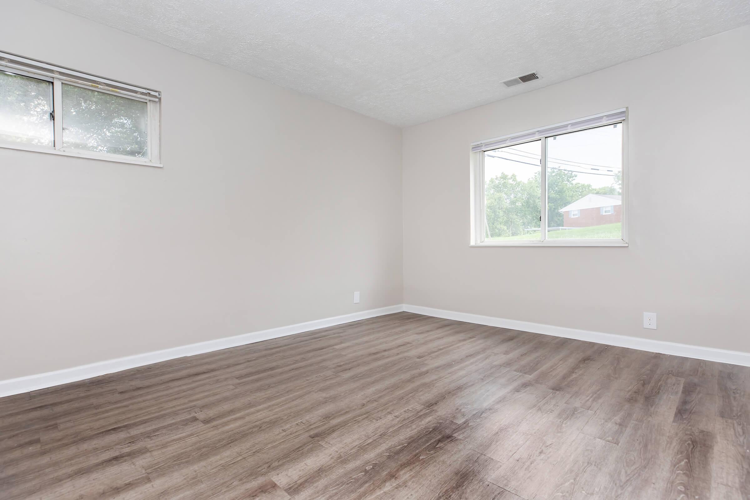 a bedroom with a large window