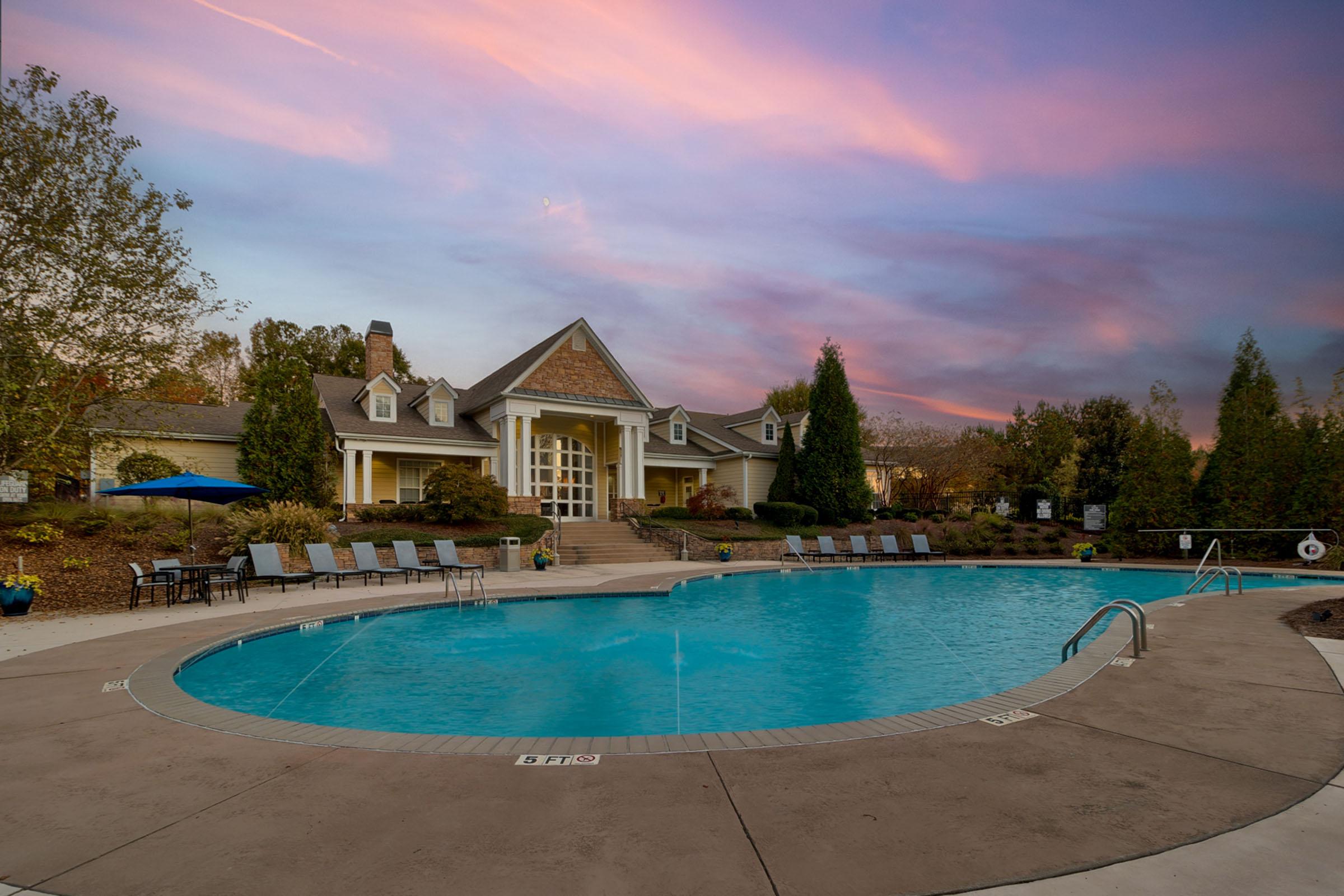 an empty pool next to a body of water