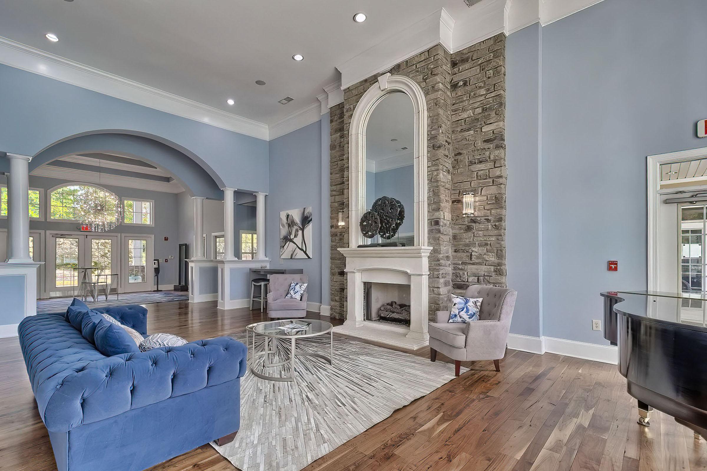 a living room filled with furniture and a large window