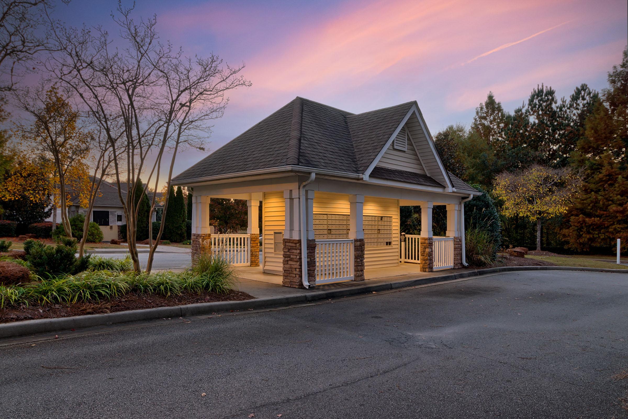 a small house in the middle of a road