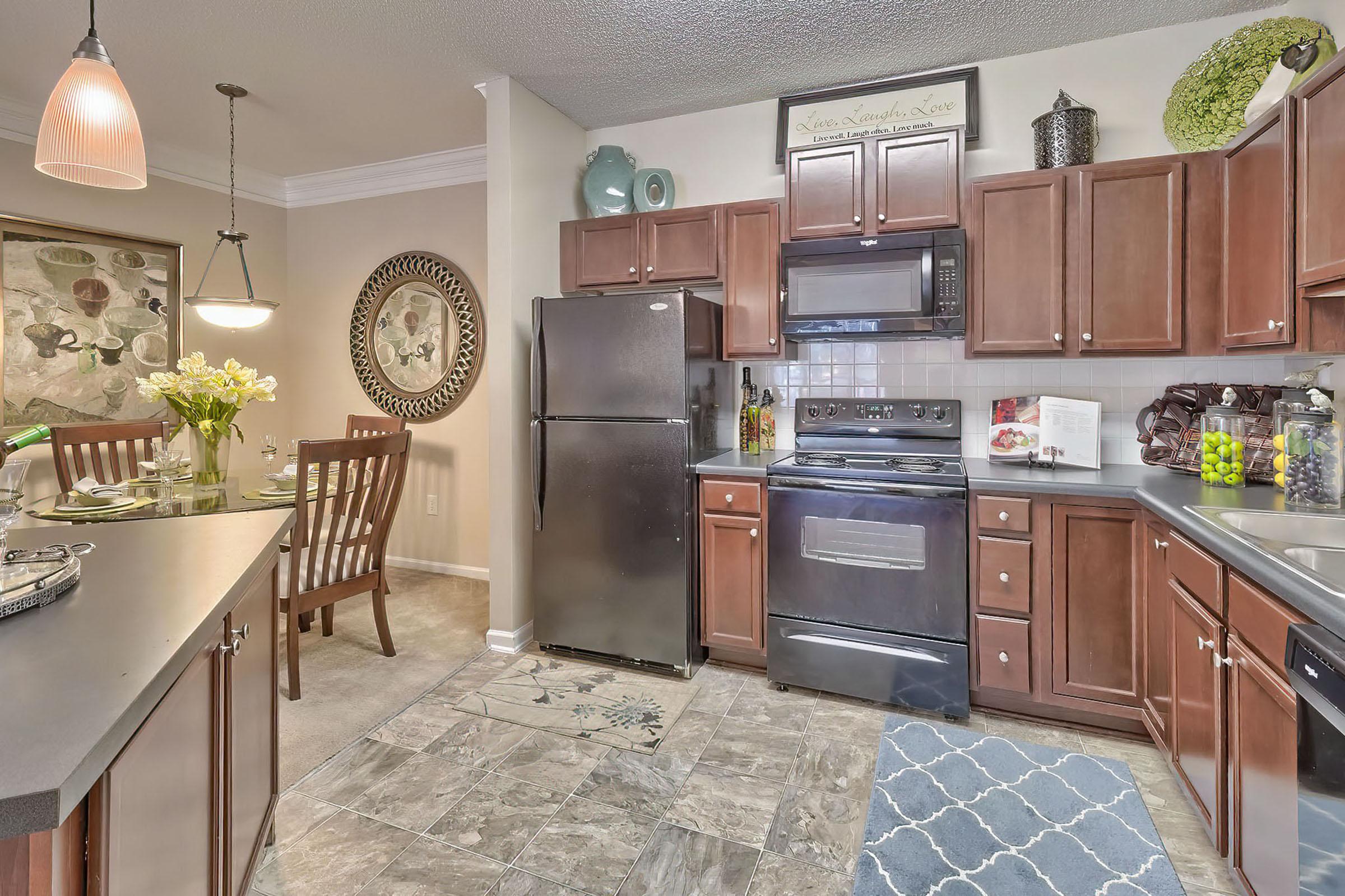 a kitchen filled with lots of furniture