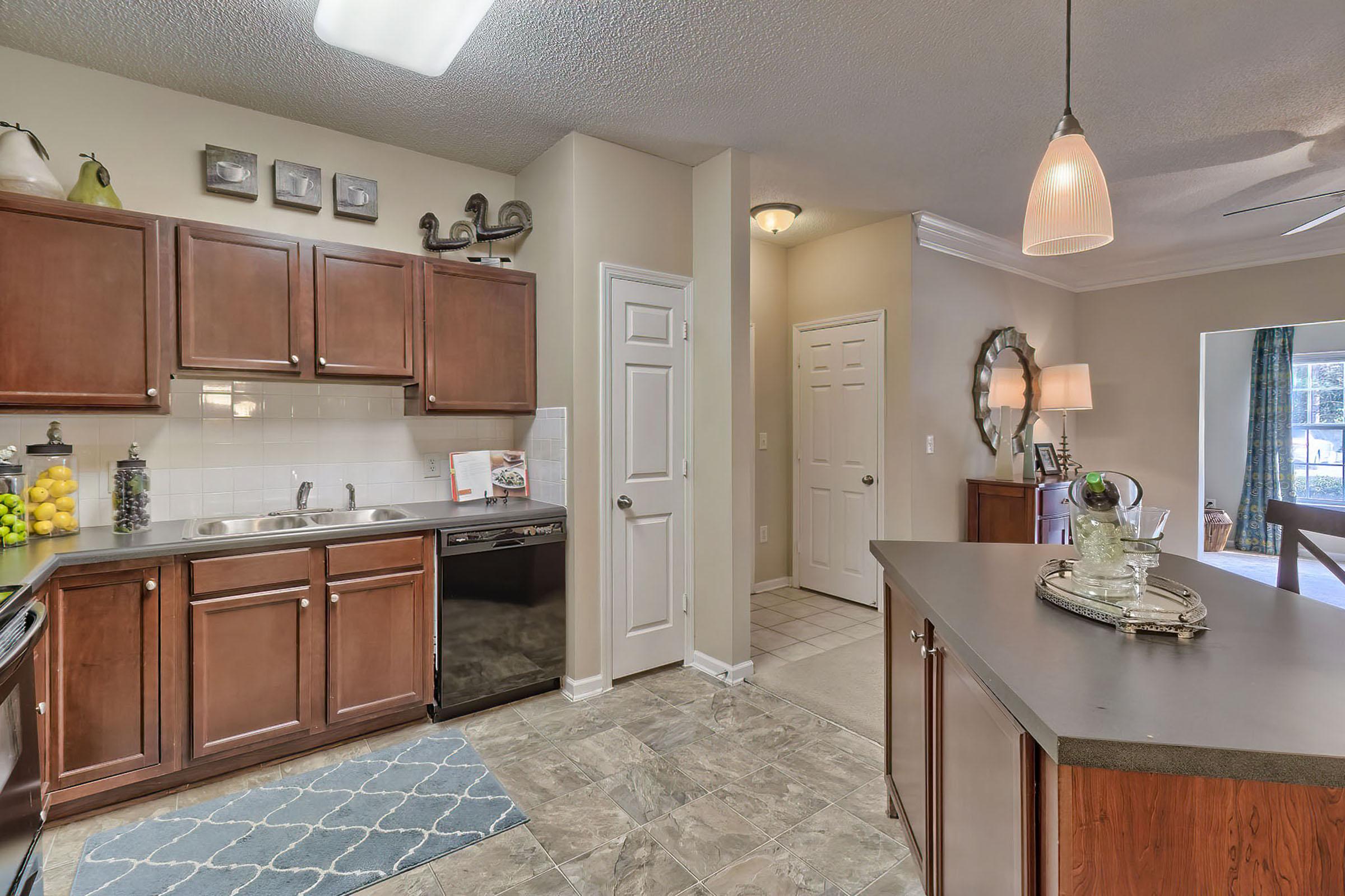 a kitchen filled with lots of furniture