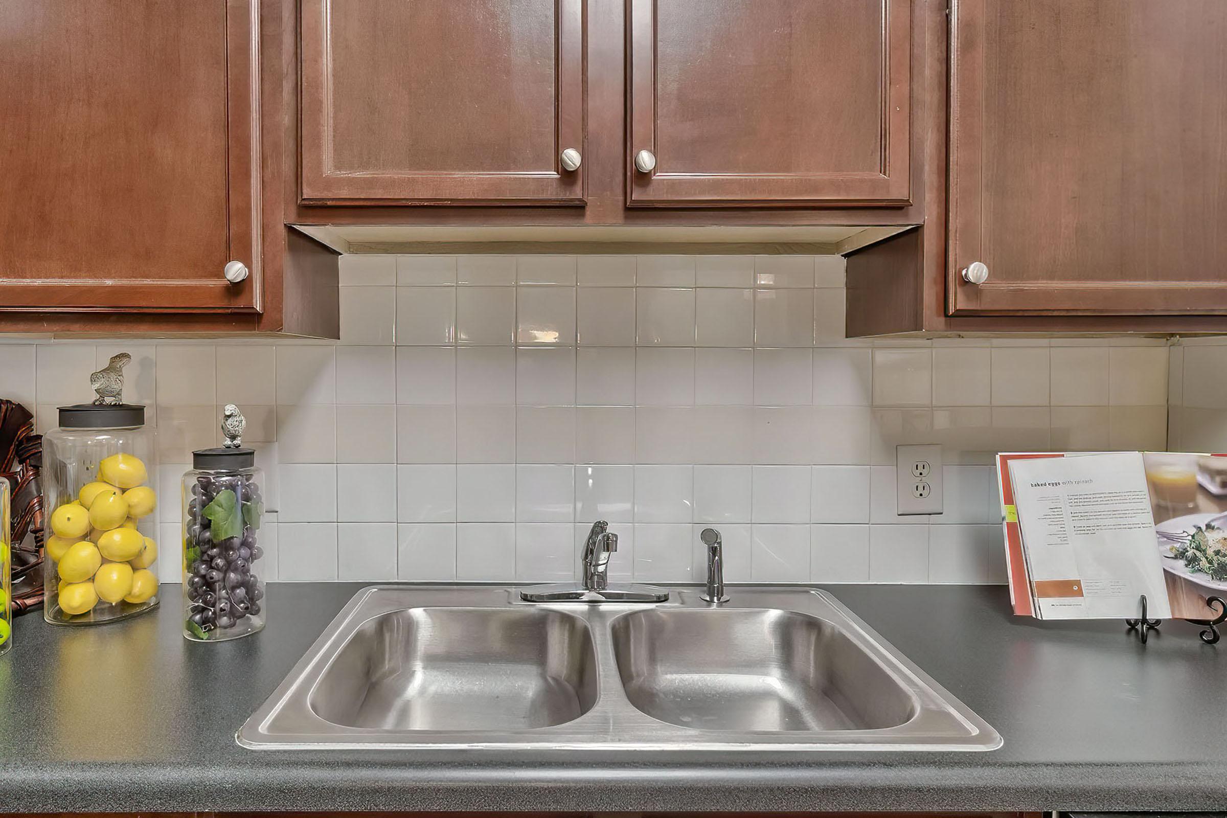 a kitchen with a stainless steel sink