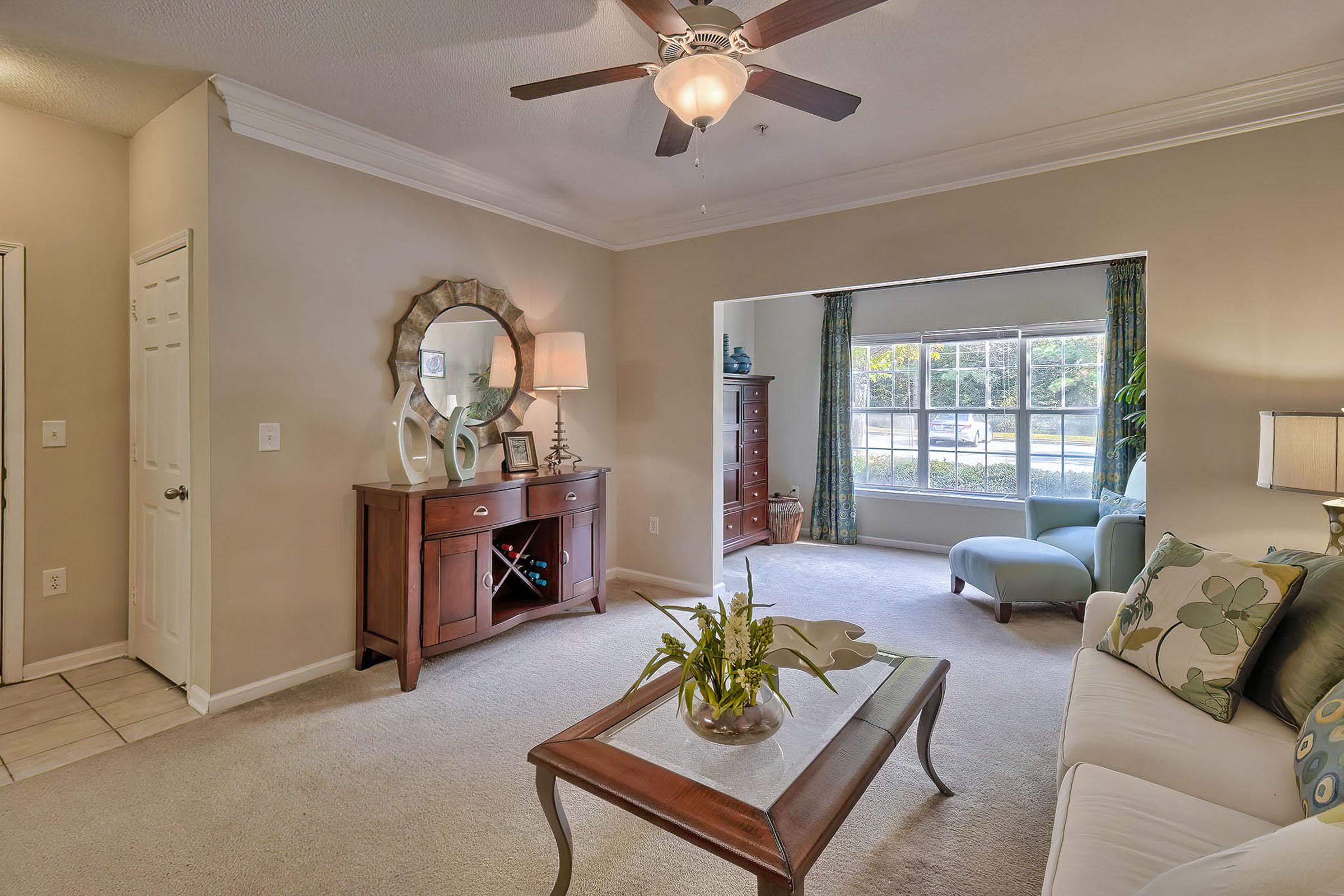 a living room filled with furniture and a fireplace