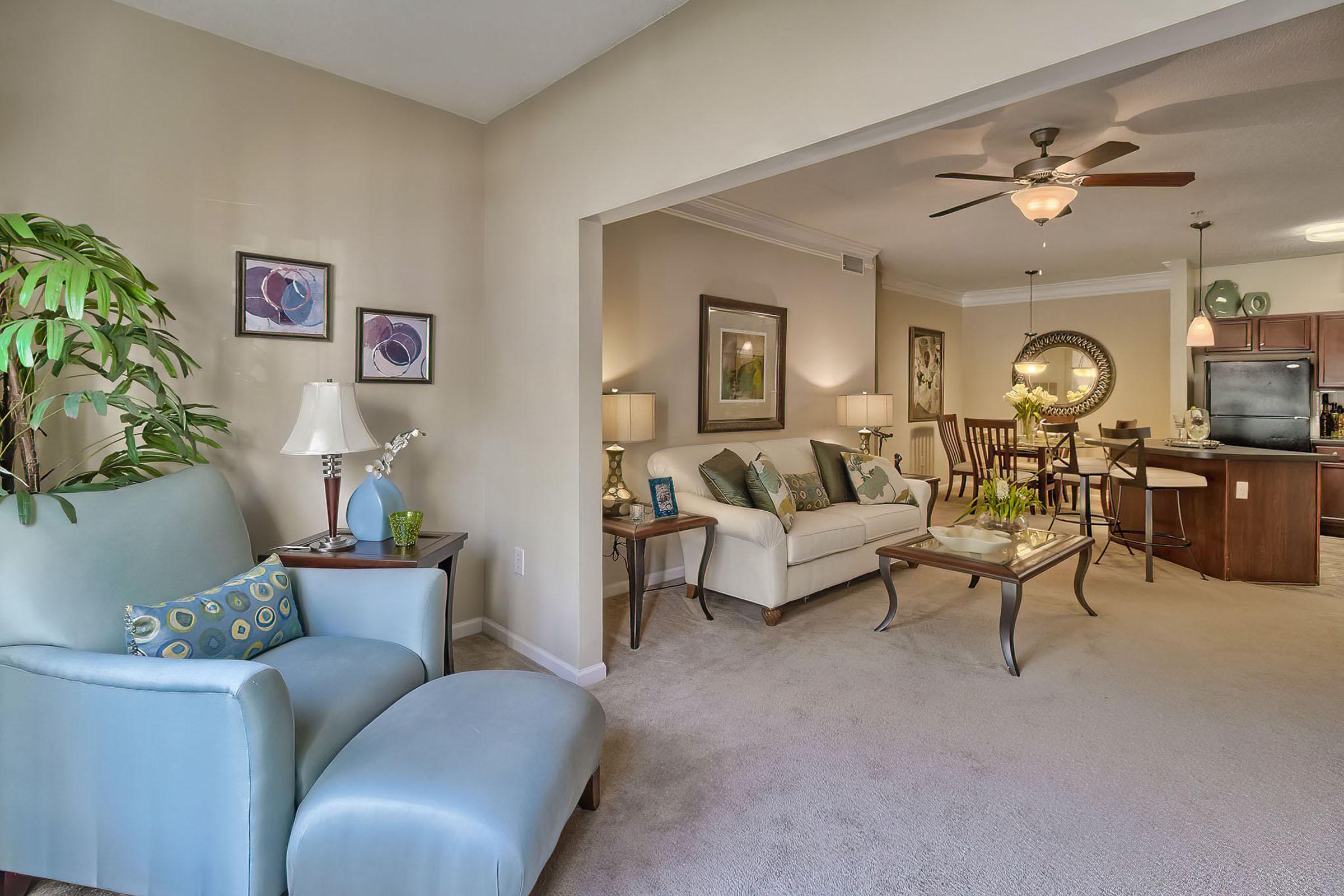 a living room filled with furniture and a fireplace