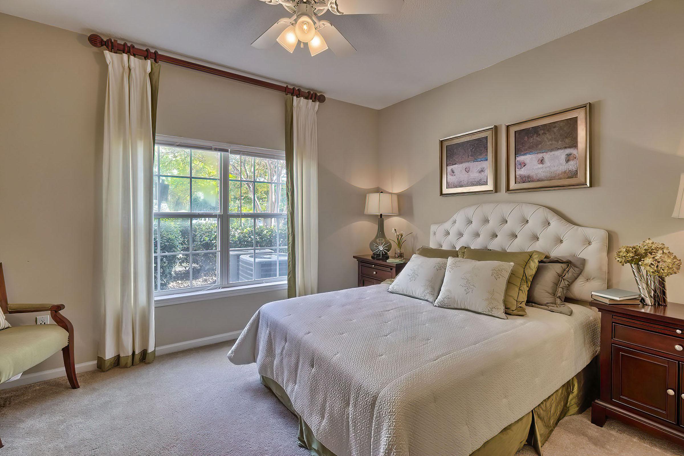 a bedroom with a large bed in a hotel room