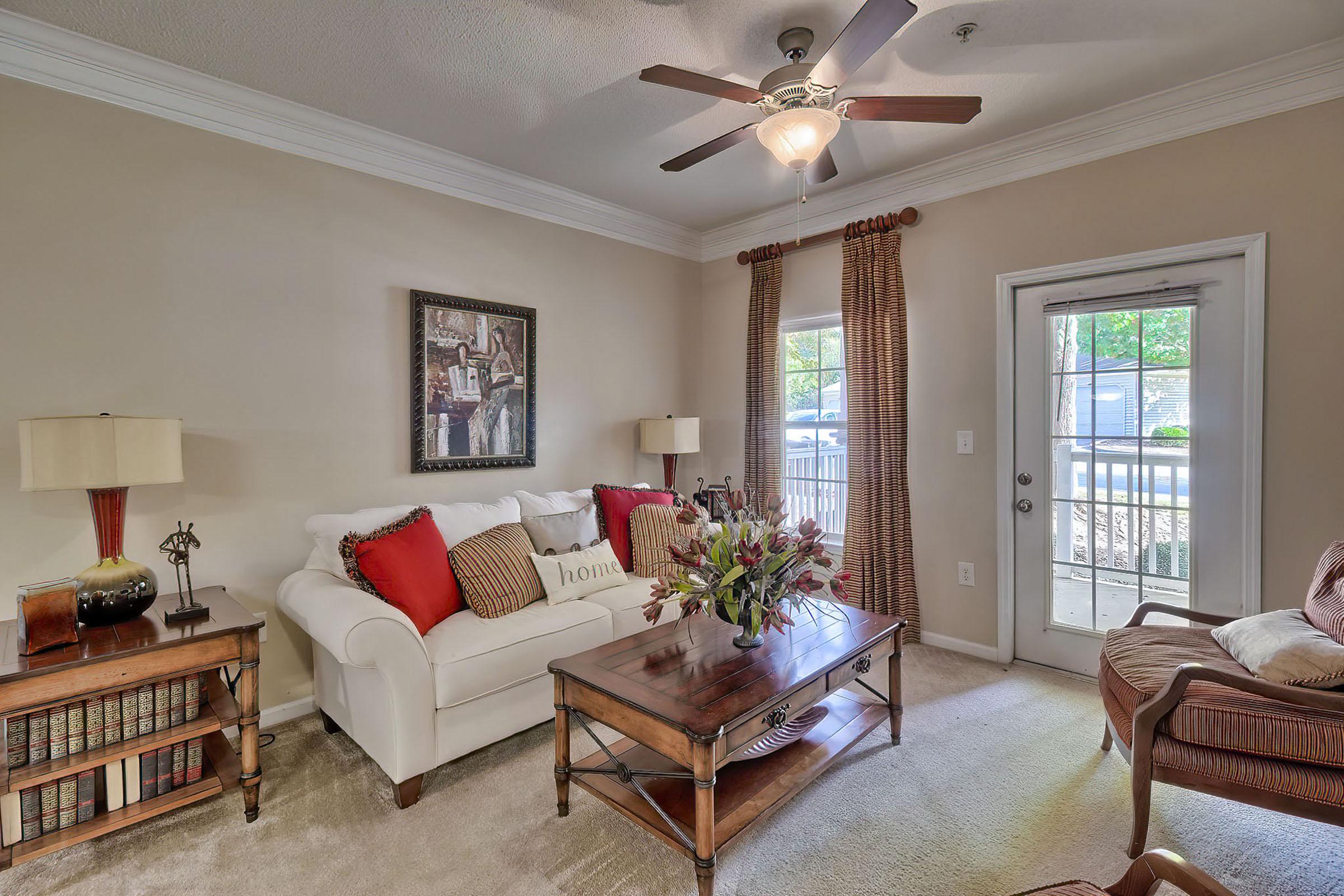 a living room filled with furniture and a fire place