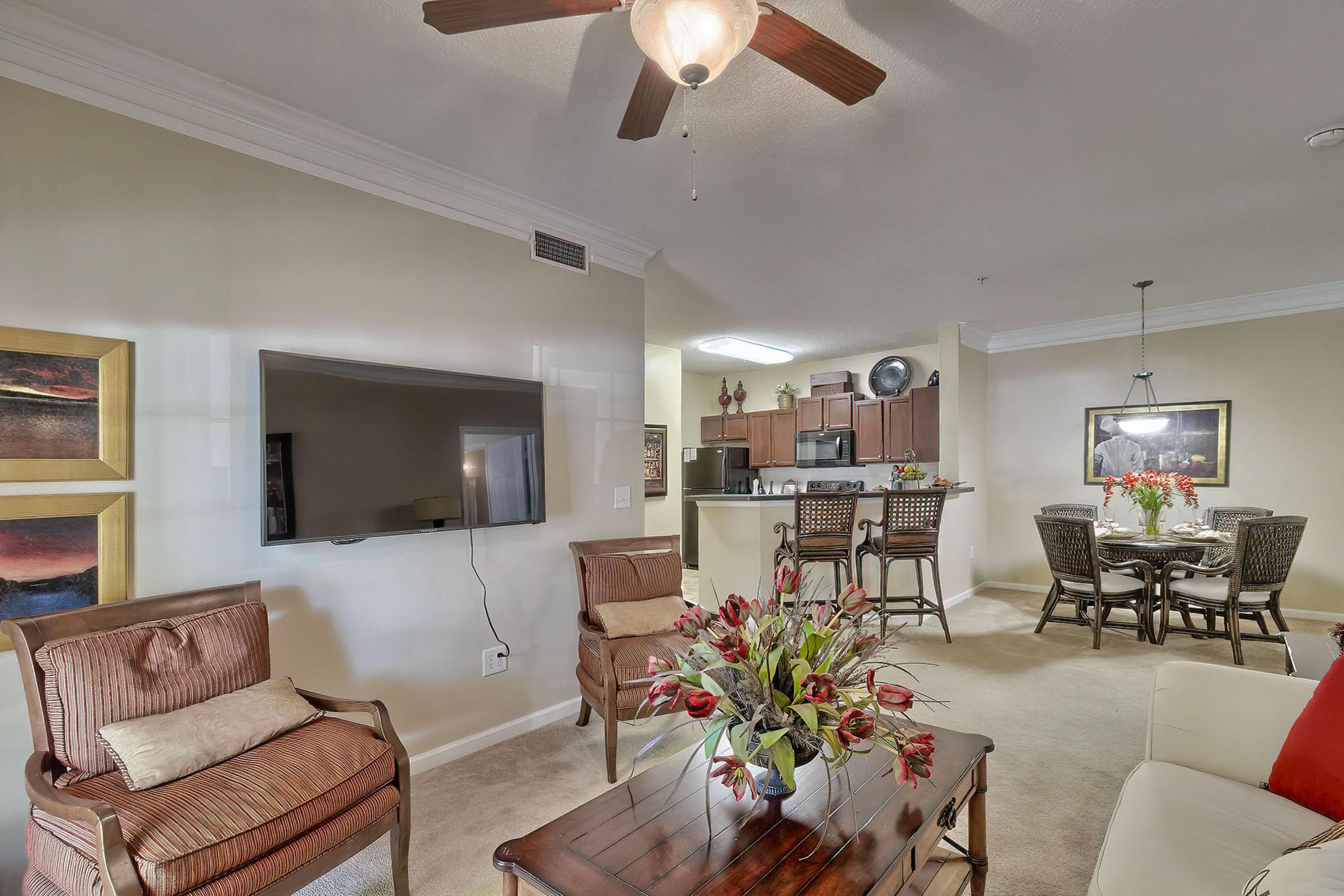 a living room filled with furniture and a fire place