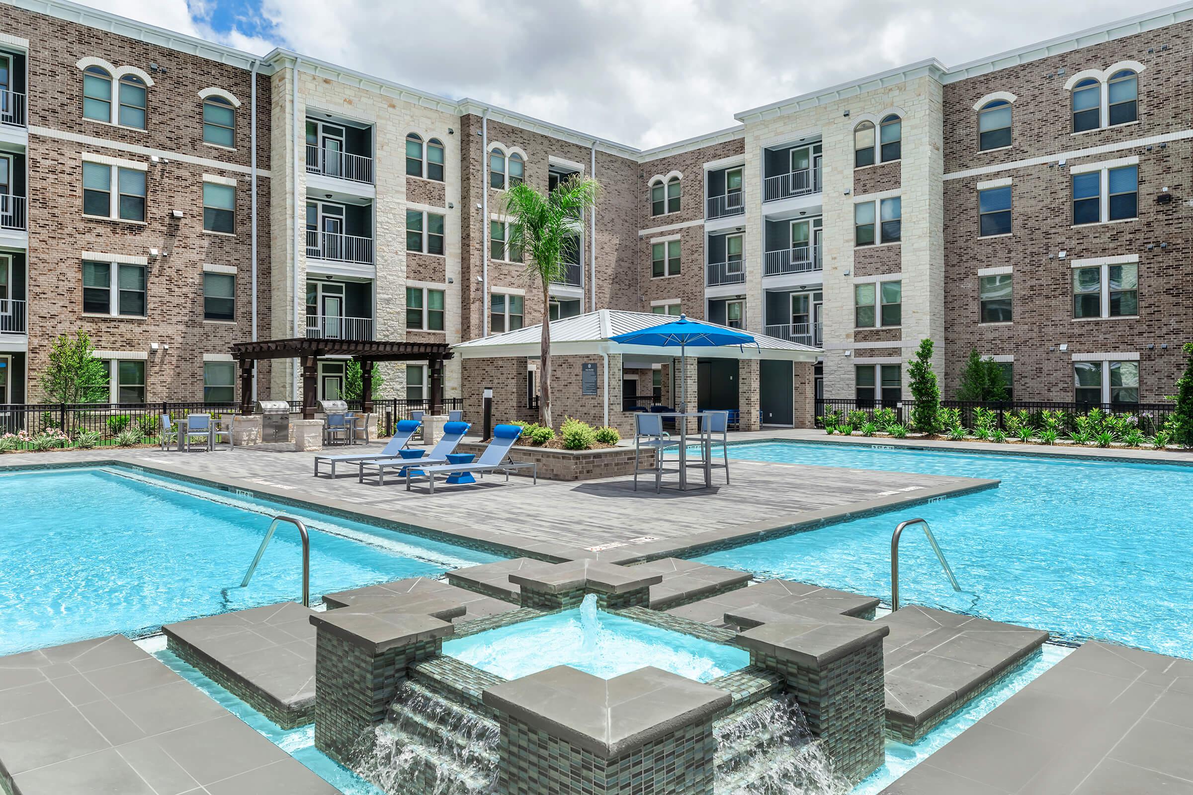 a large pool of water in front of a building