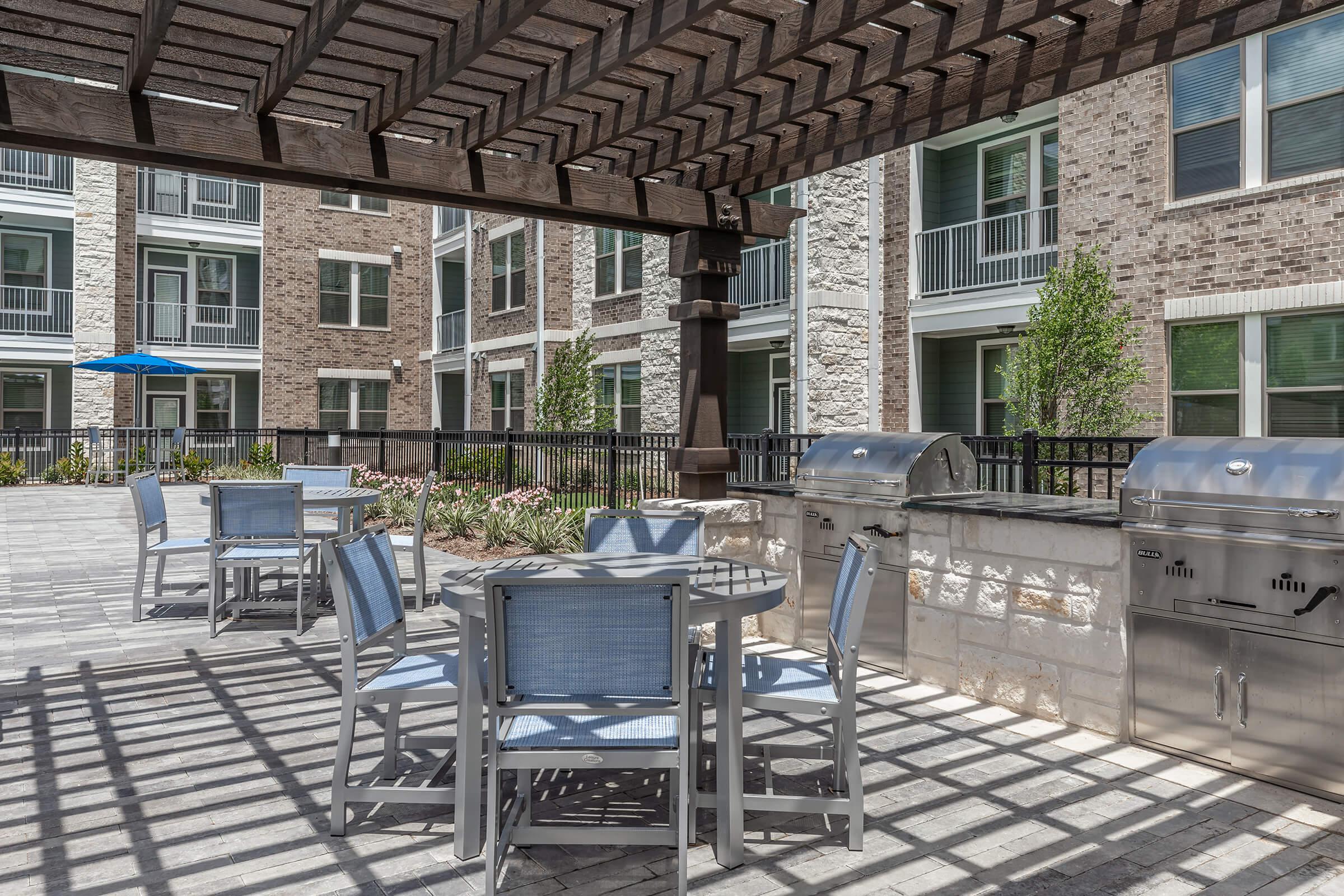 a bench in front of a brick building