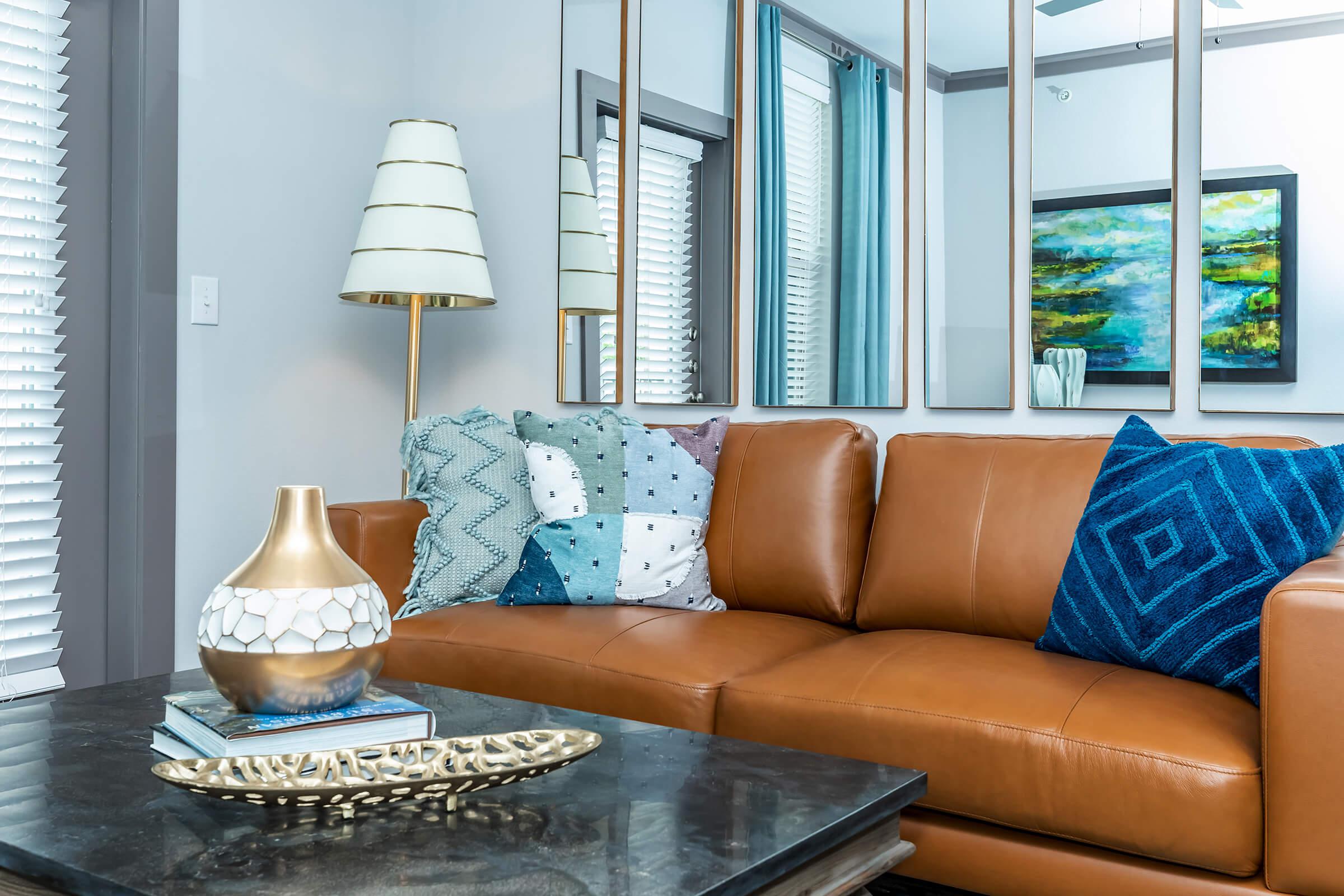 a brown leather couch in a living room