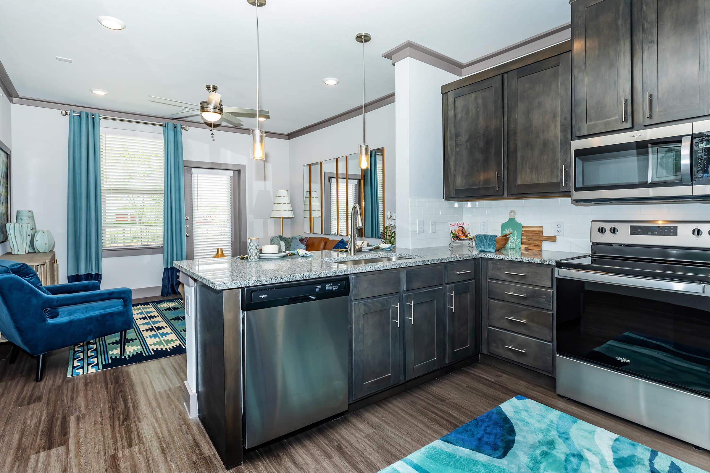 a modern kitchen with stainless steel appliances