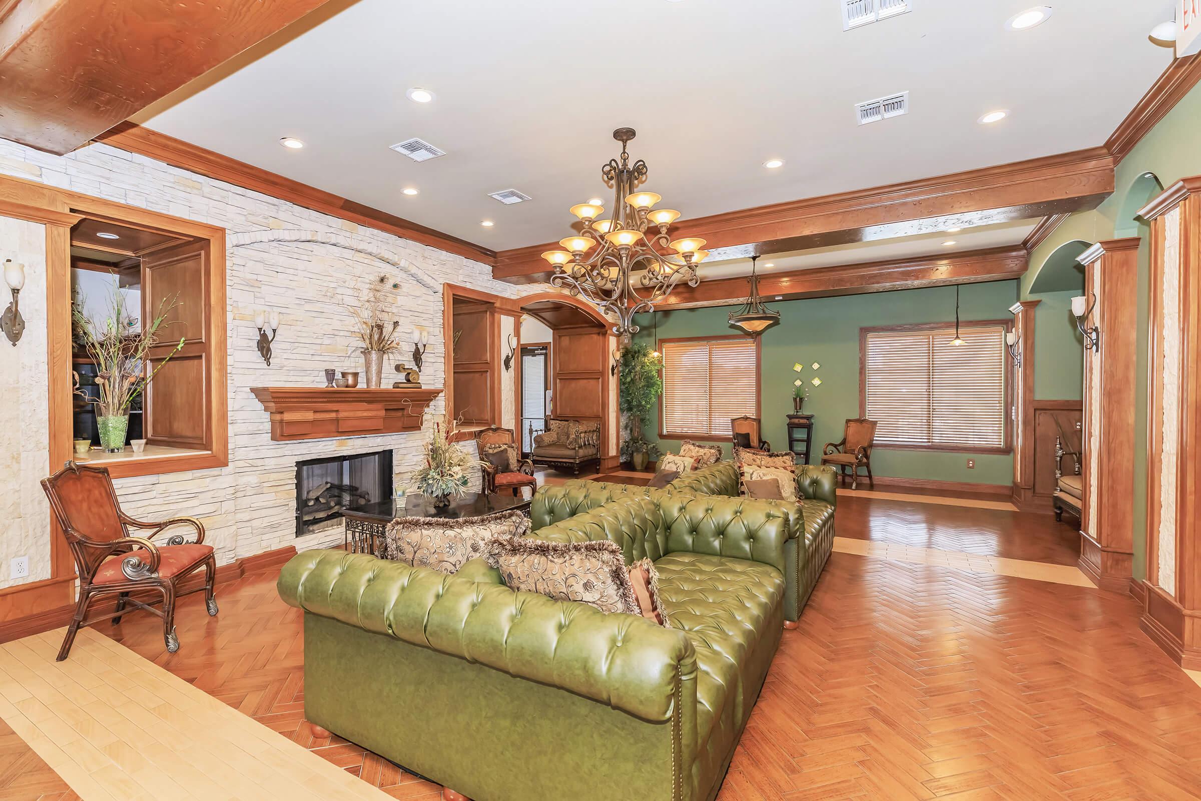 a living room filled with furniture and a fireplace