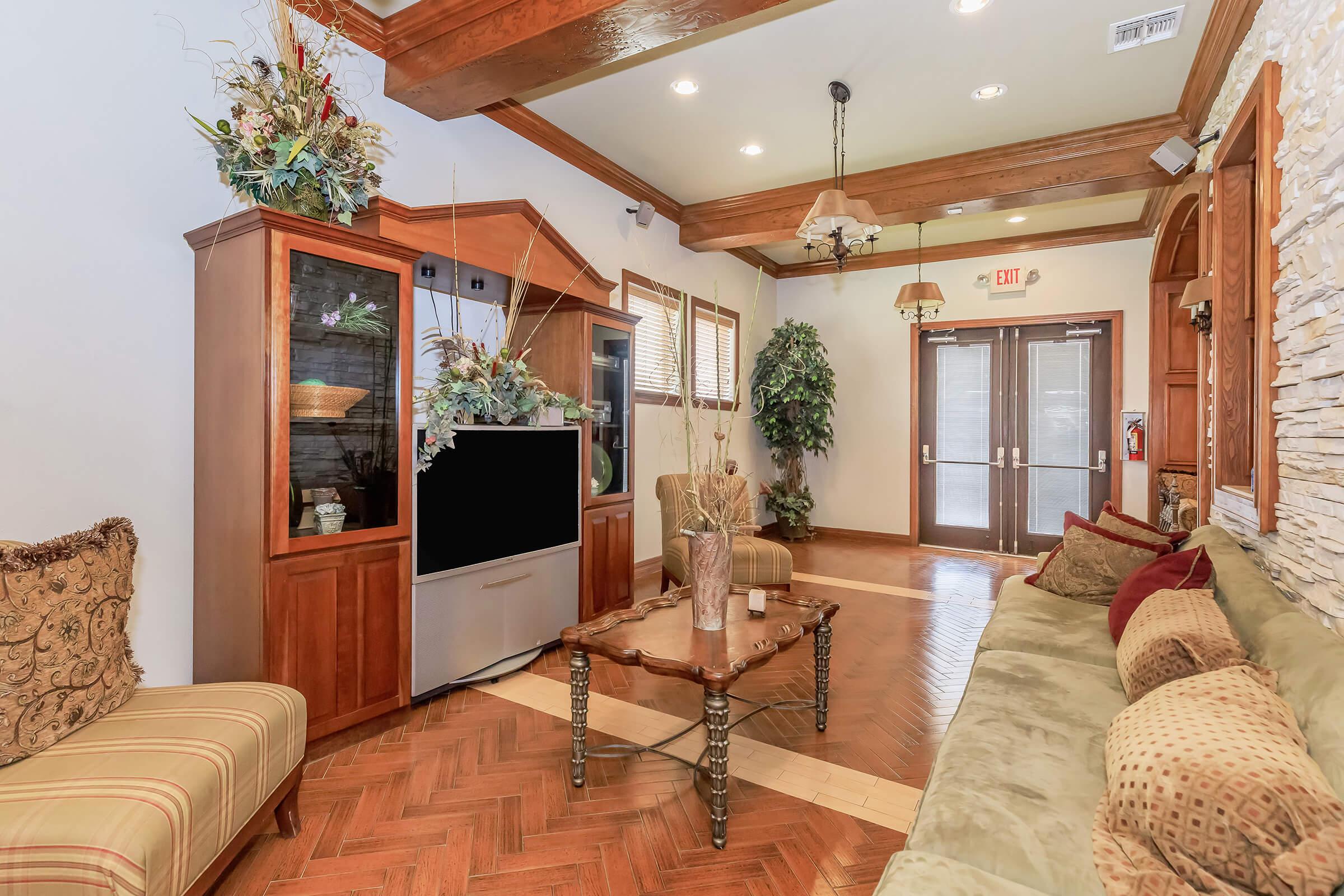 a living room filled with furniture and a large window