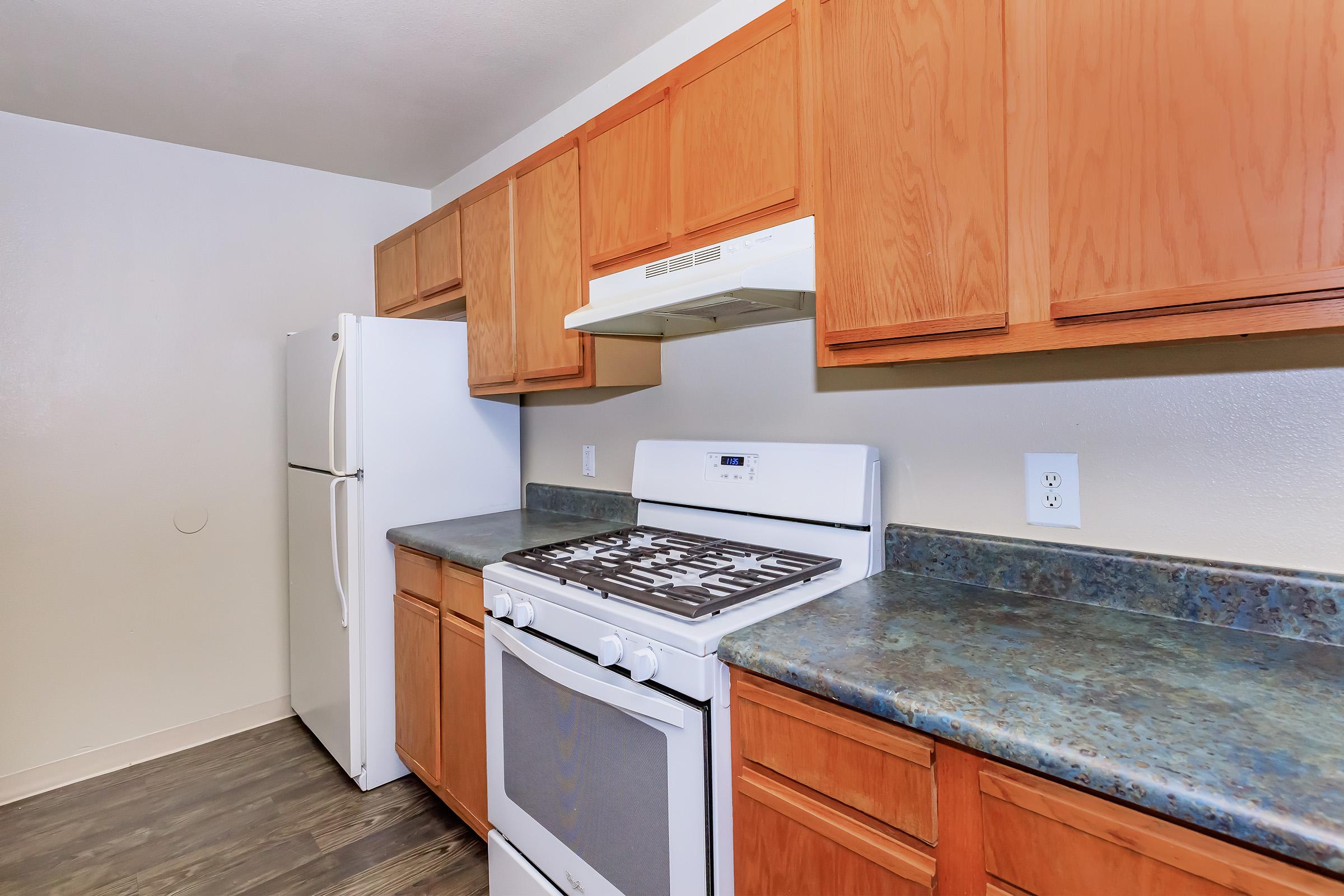 a kitchen with a stove top oven