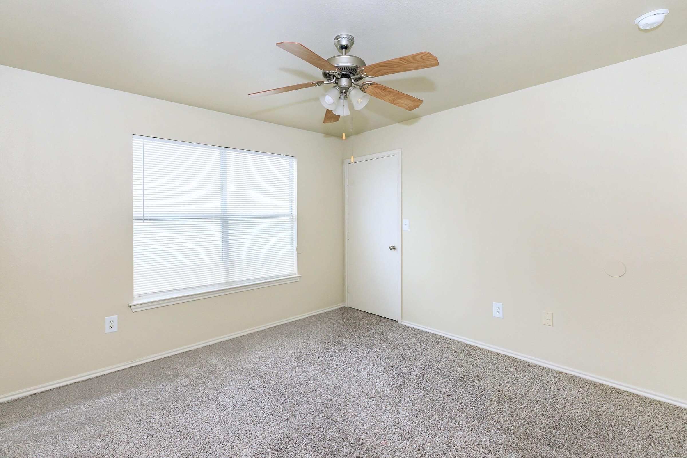 a bedroom with a large mirror