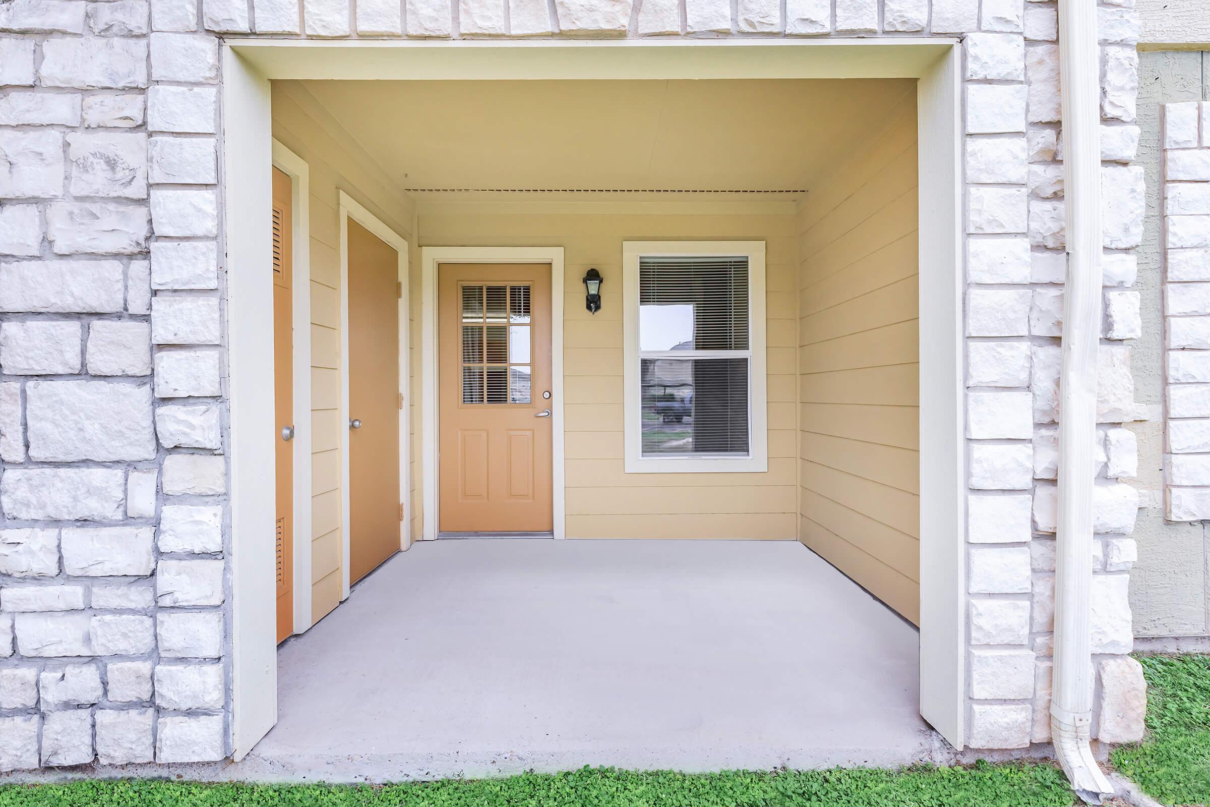 a door is open to a brick building