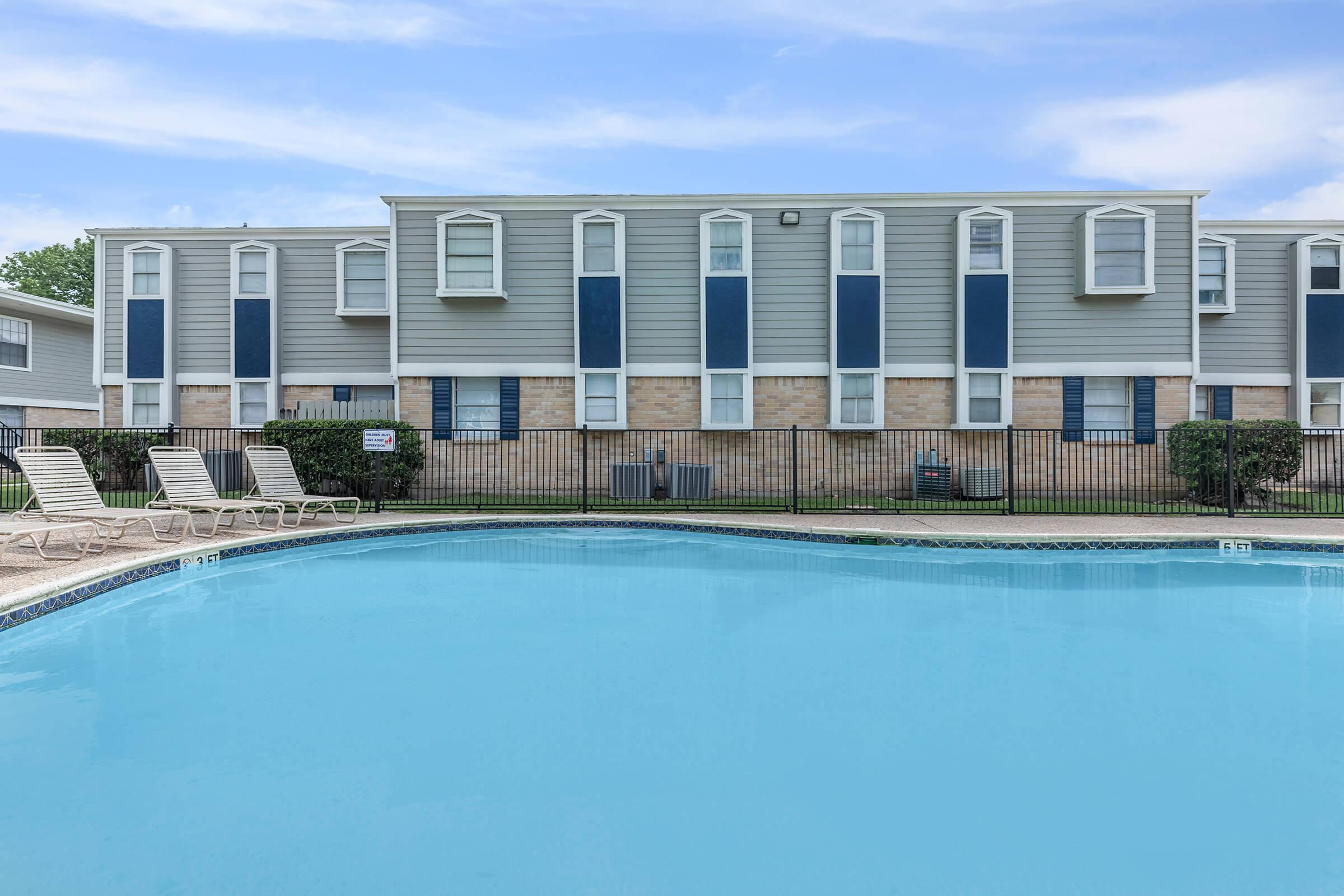 a large pool of water in front of a building