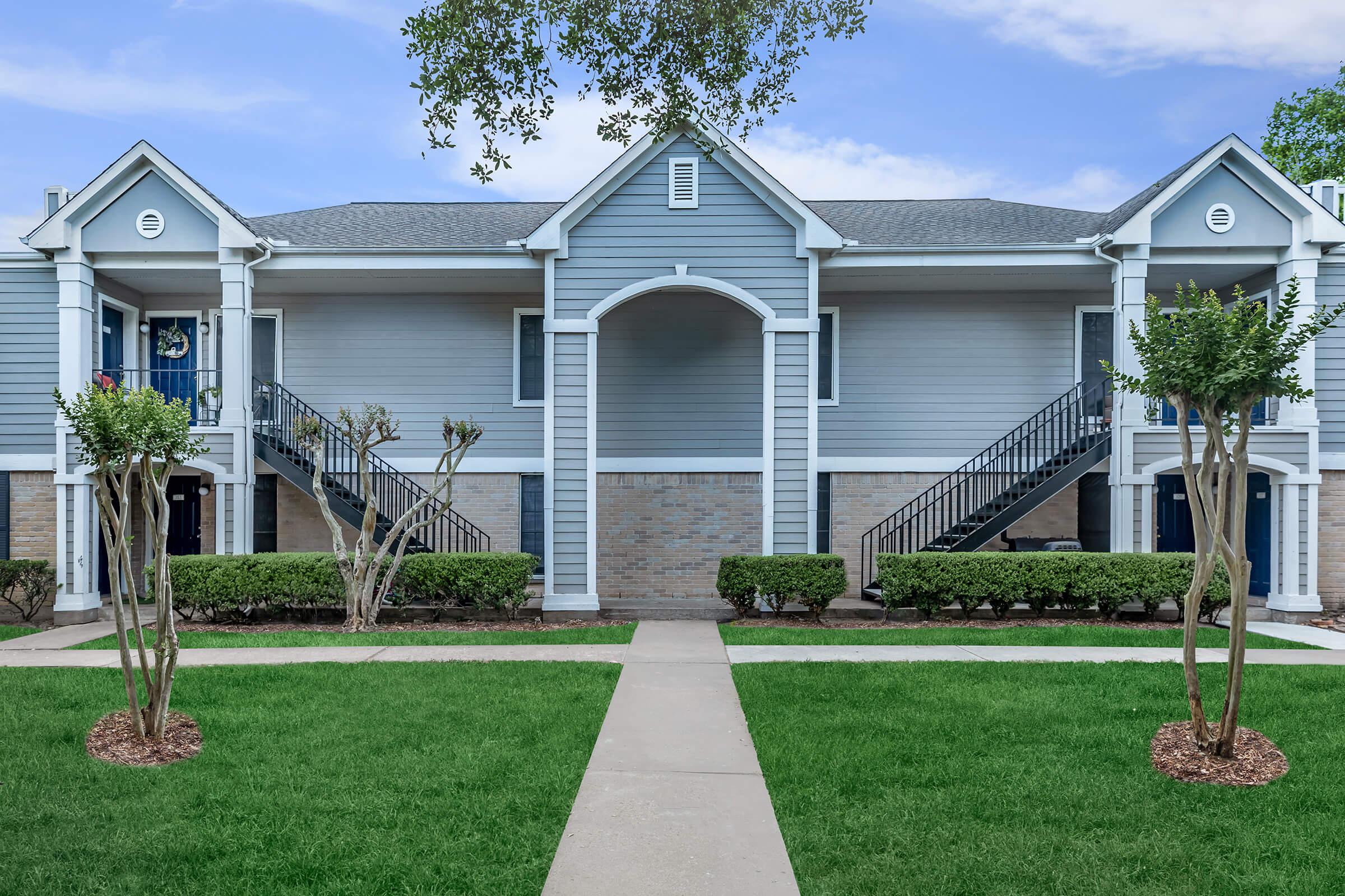 a large lawn in front of a house