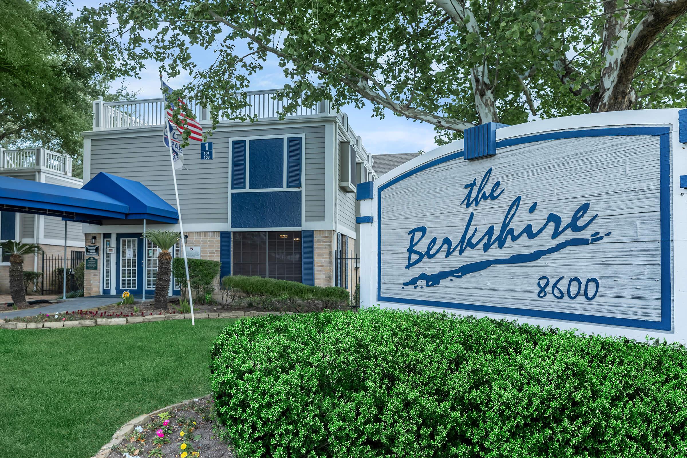 a sign in front of a house