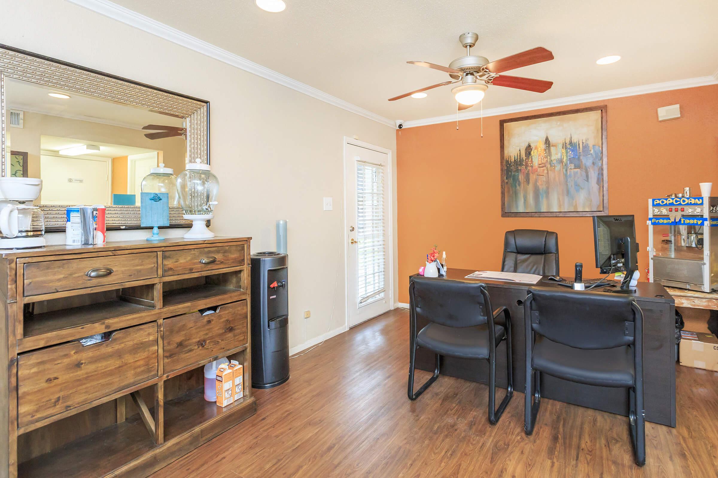 a living room filled with furniture and a tv