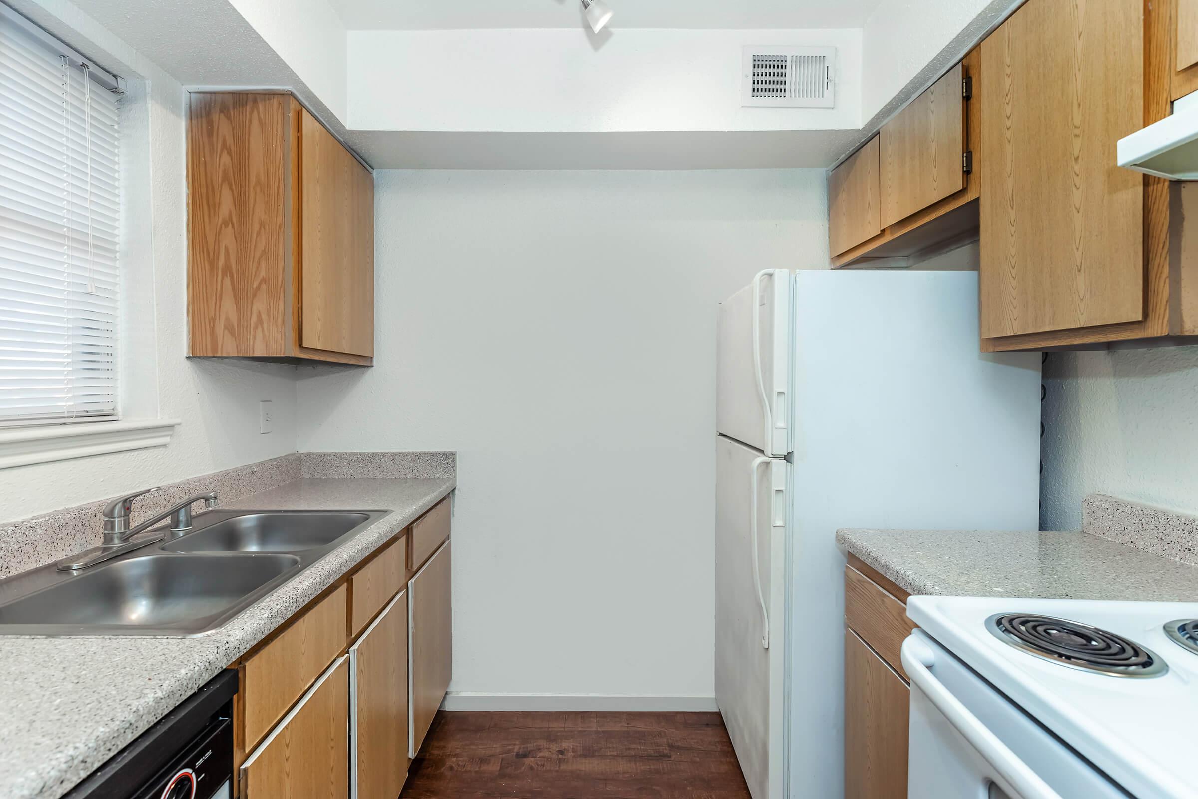 a kitchen with a stove oven and refrigerator