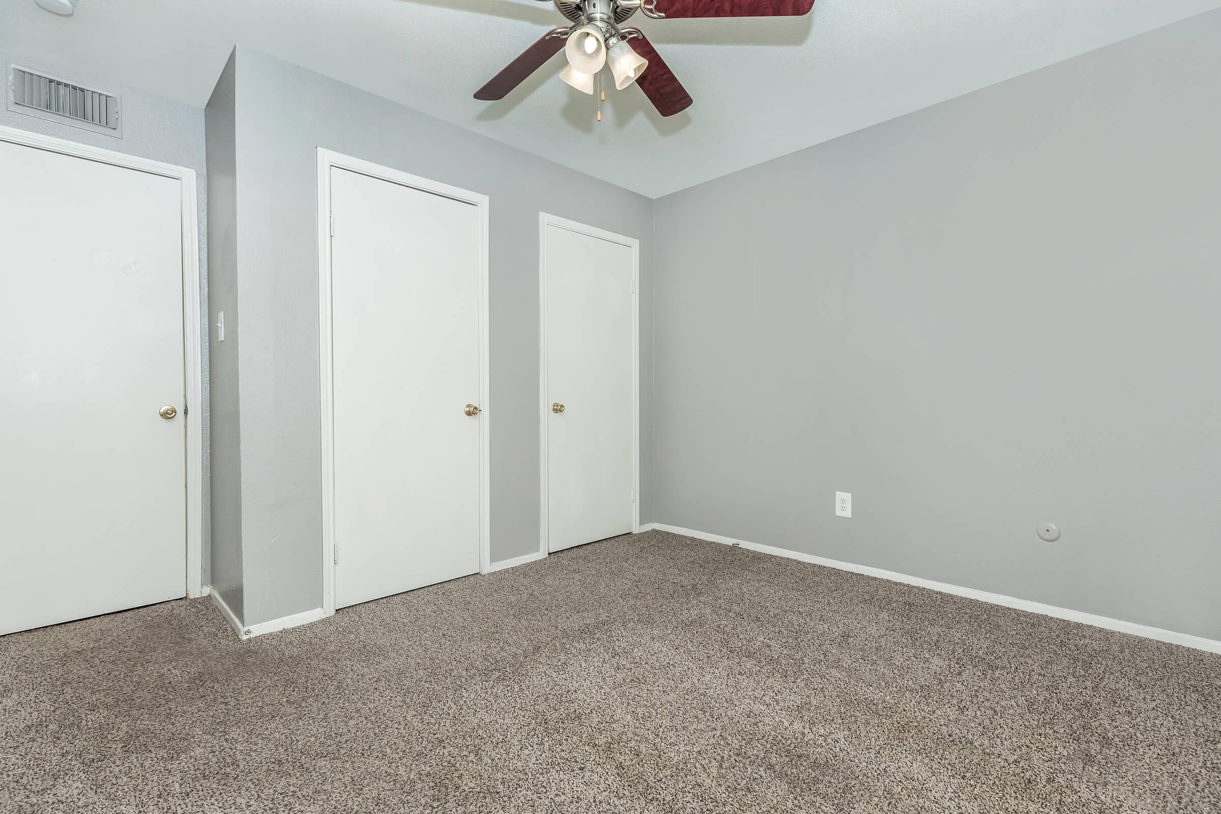 a bedroom with a large mirror