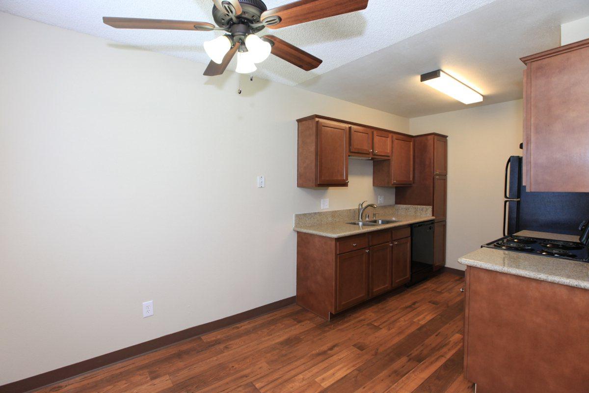 a kitchen with a wood floor