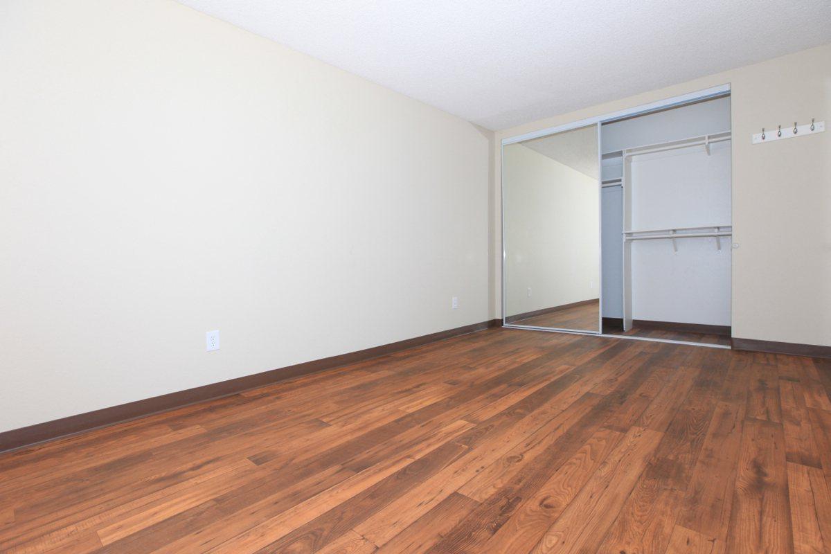 a large empty room with a wooden floor