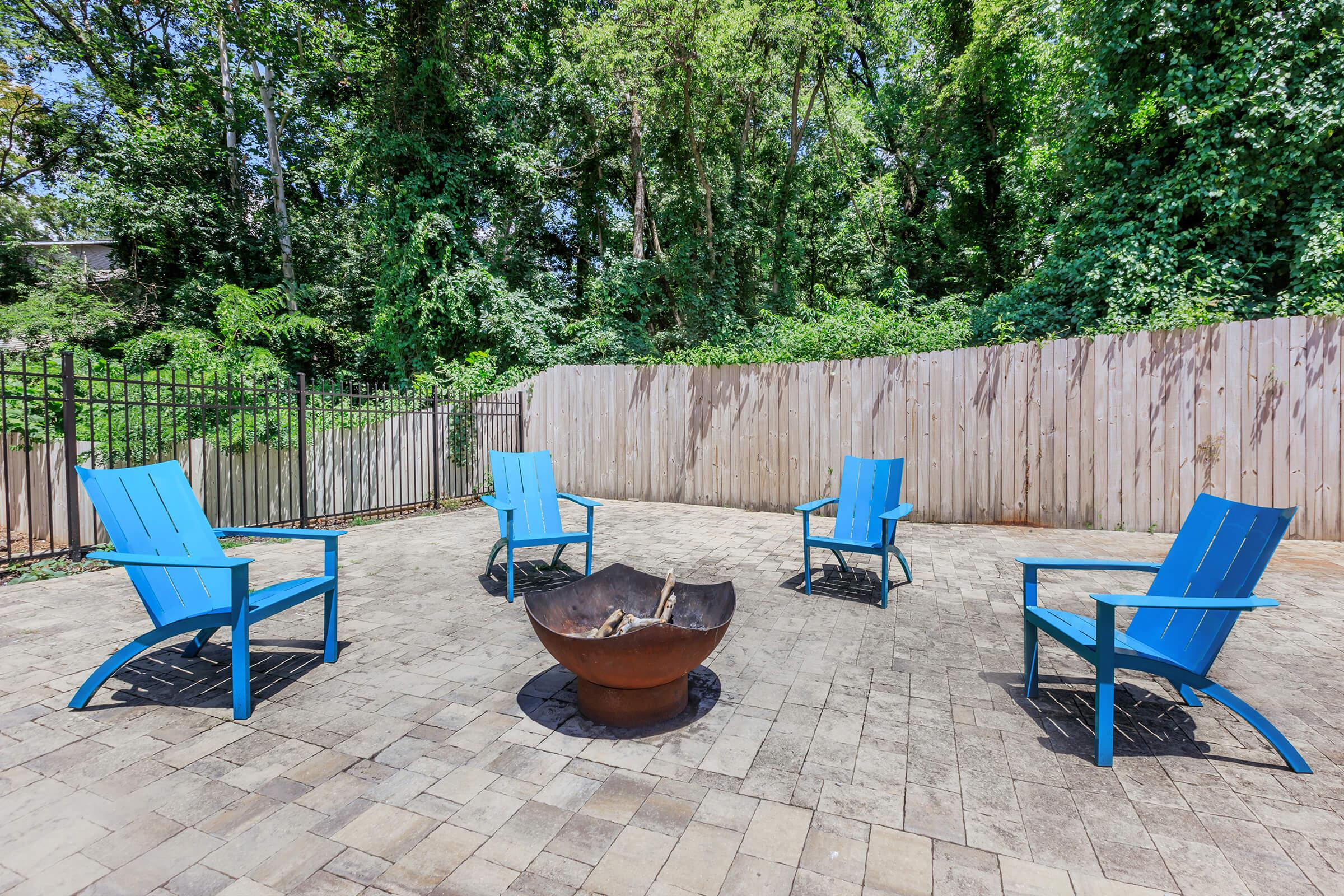 a blue bench in front of a picnic table