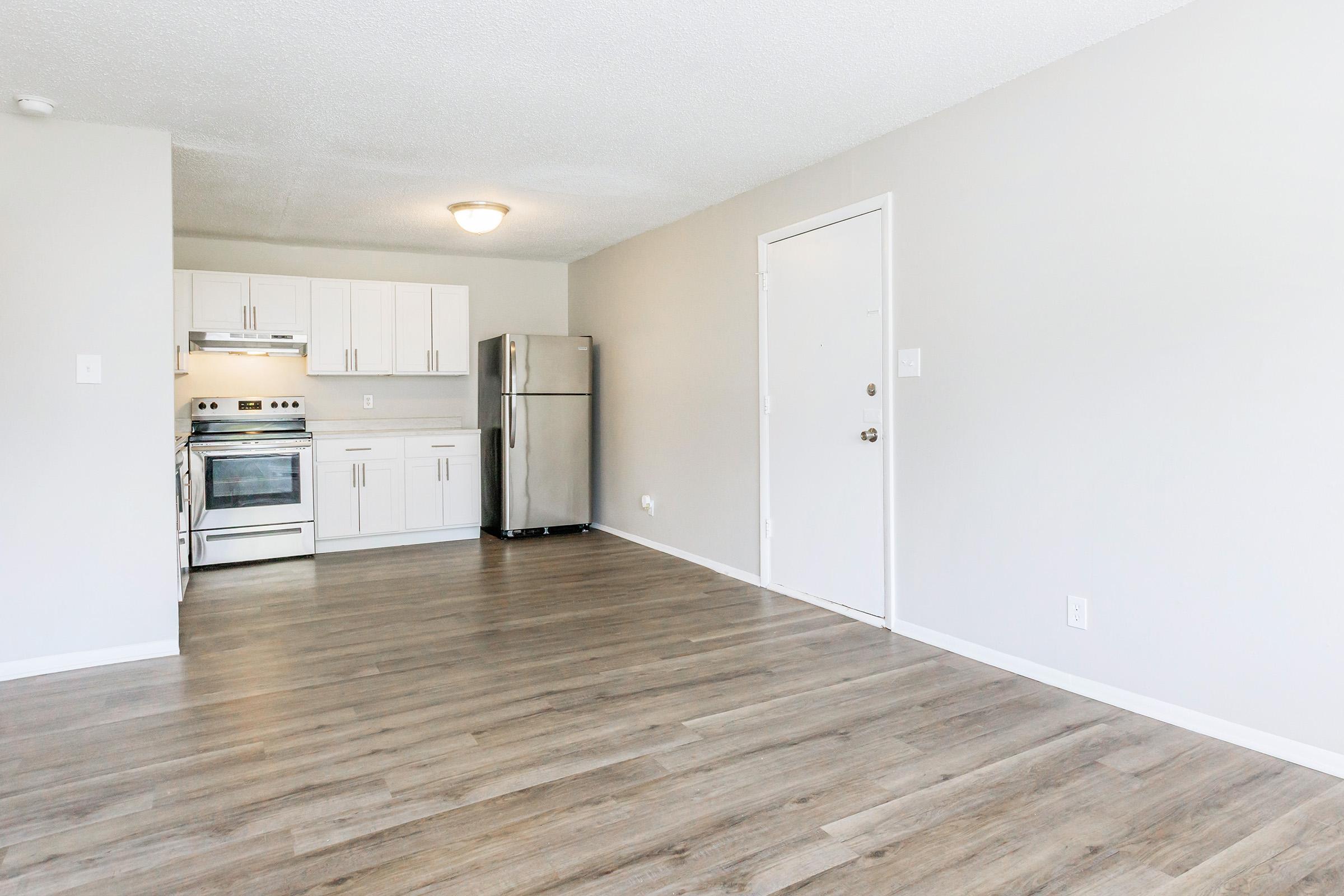 a kitchen with a wooden floor