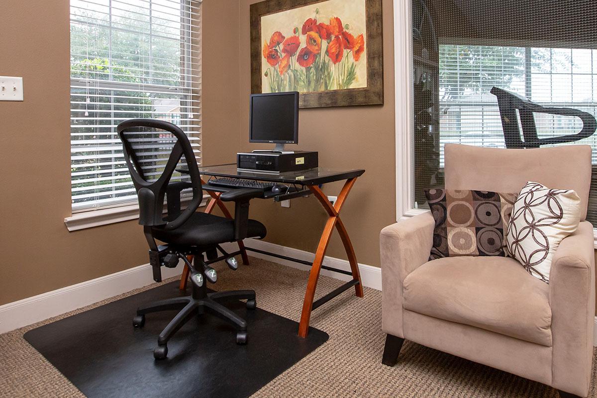 a living room with a leather chair