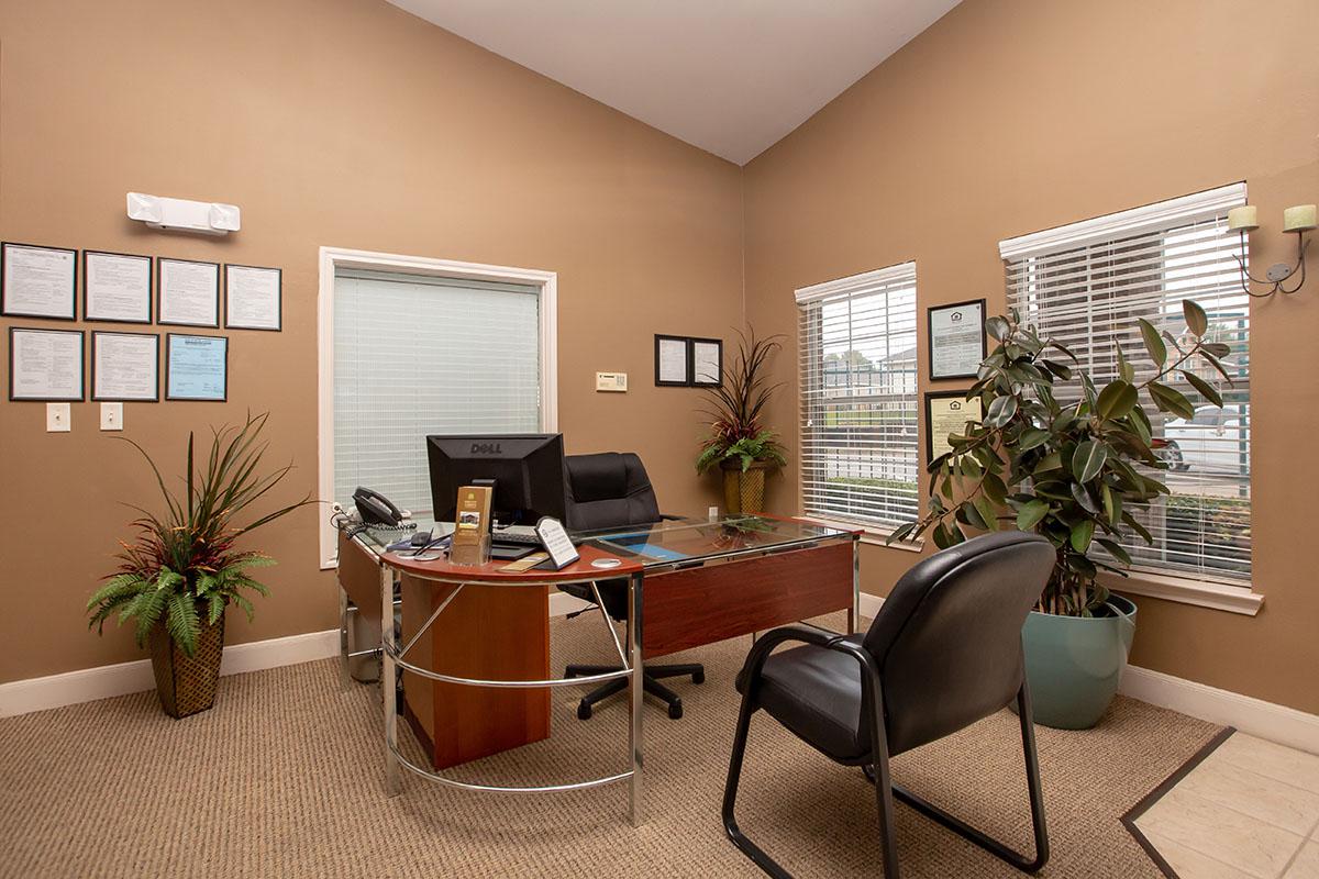 a living room filled with furniture and a large window