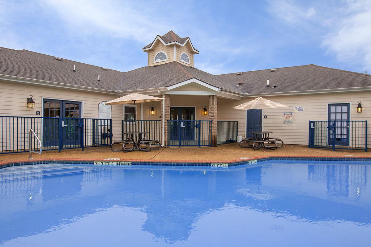 a large pool of water in front of a house