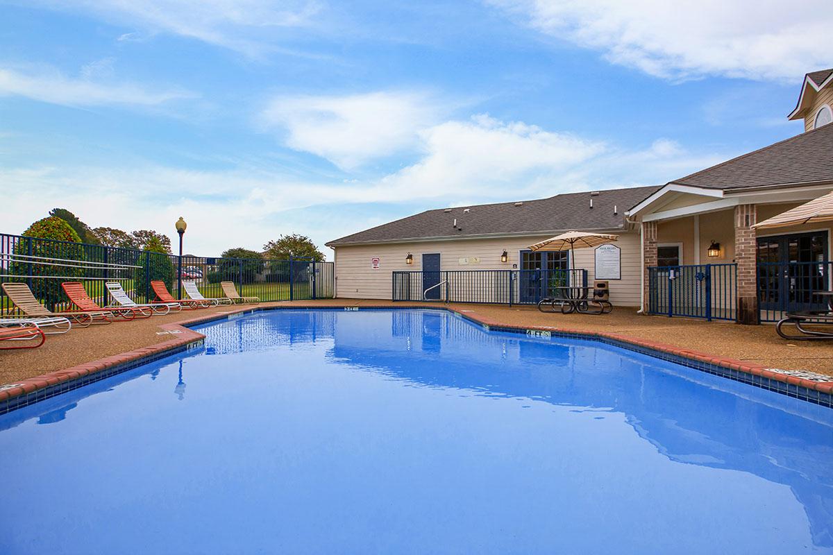 a house with a large pool of water