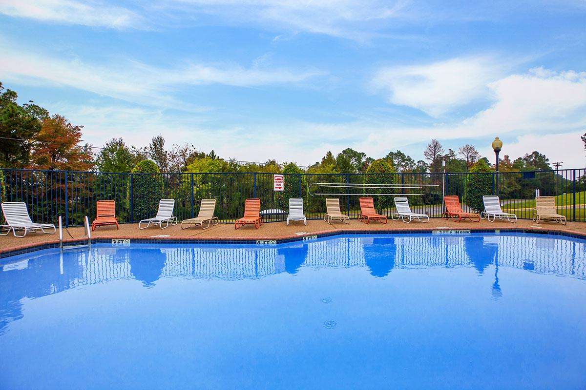 a pool next to a body of water