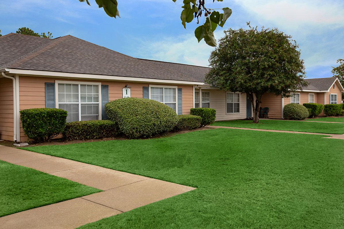 a large lawn in front of a house