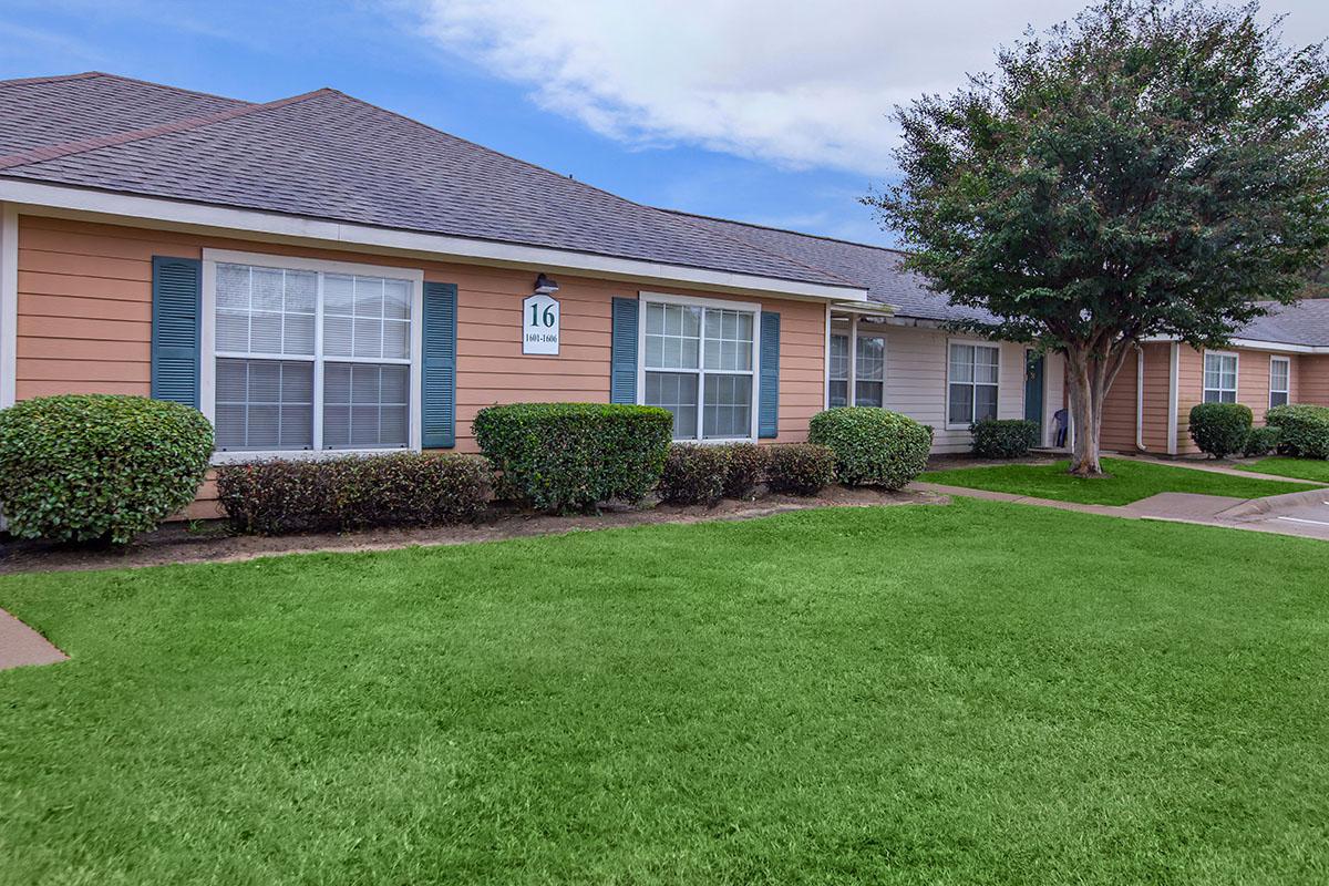 a large lawn in front of a house