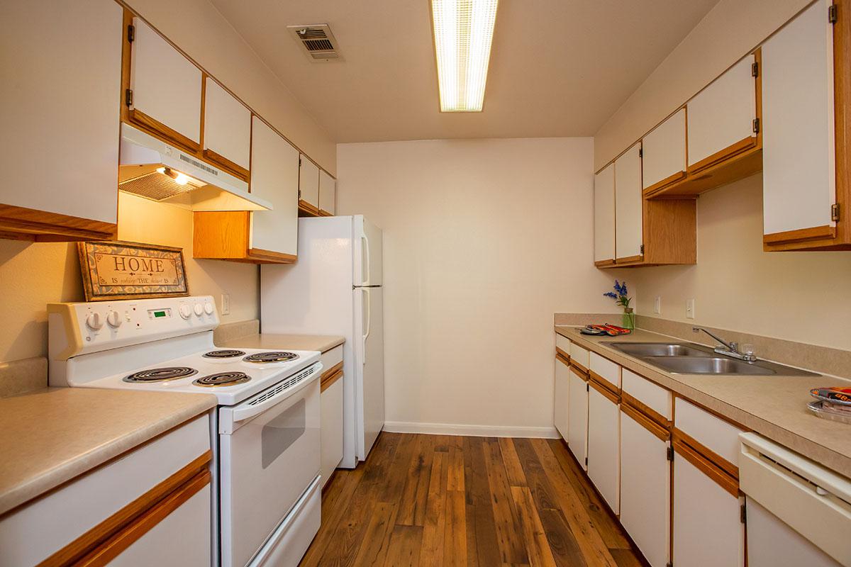 a kitchen with a stove and a refrigerator